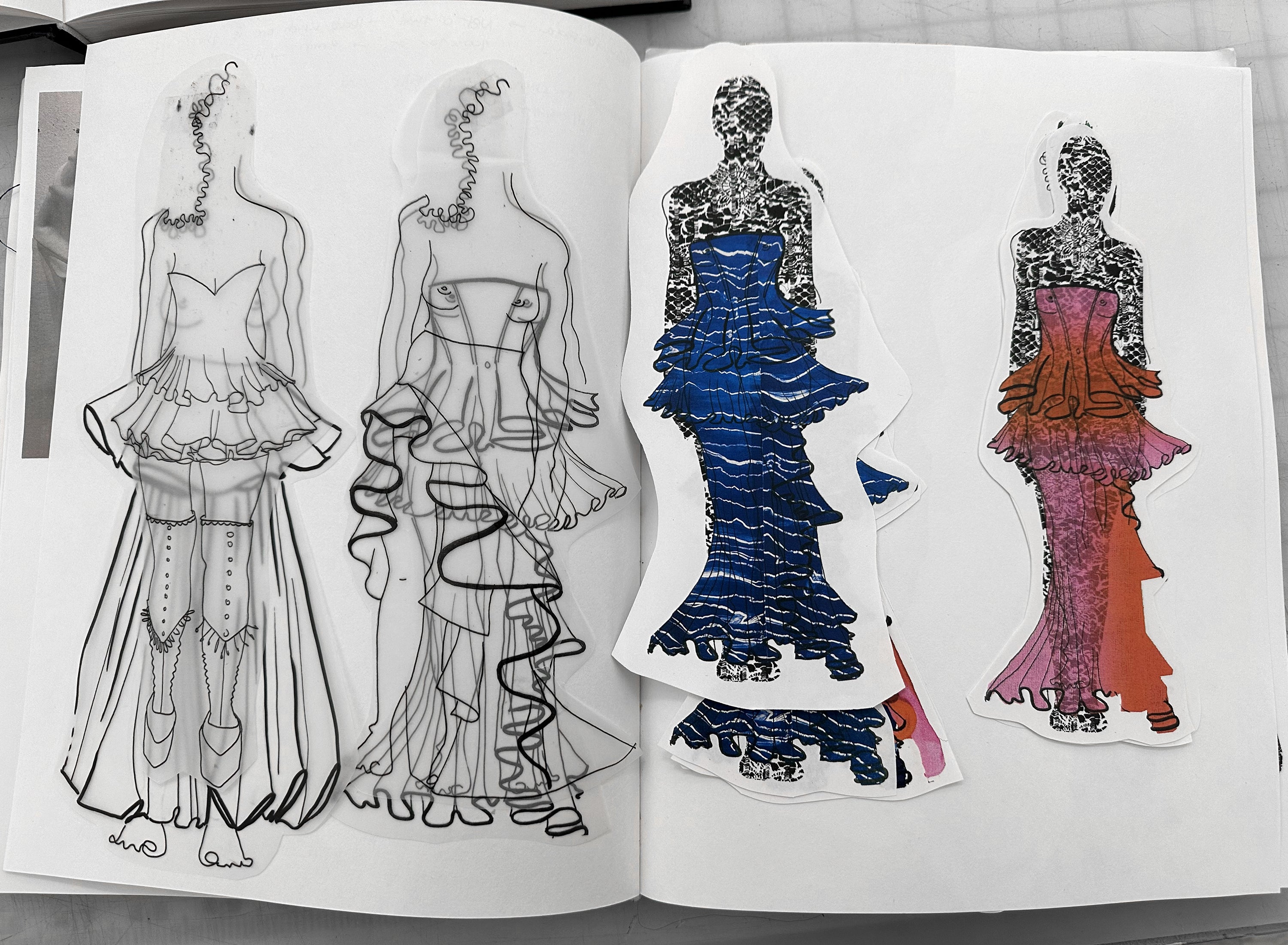 Sketchbook spread with layered fashion drawings and cut-out figures exploring sculptural garment silhouettes