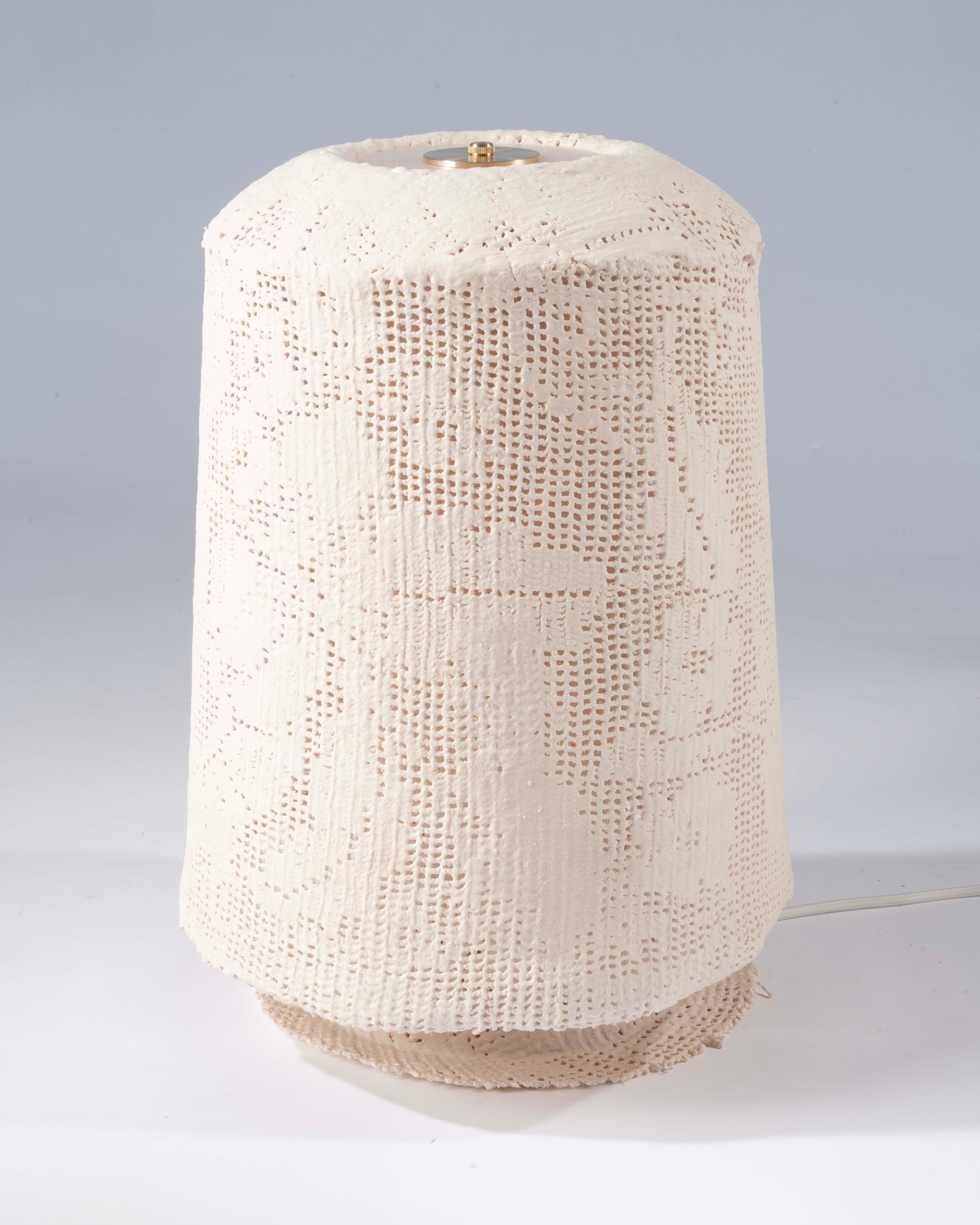 Filet crochet hardened into a table lamp. 