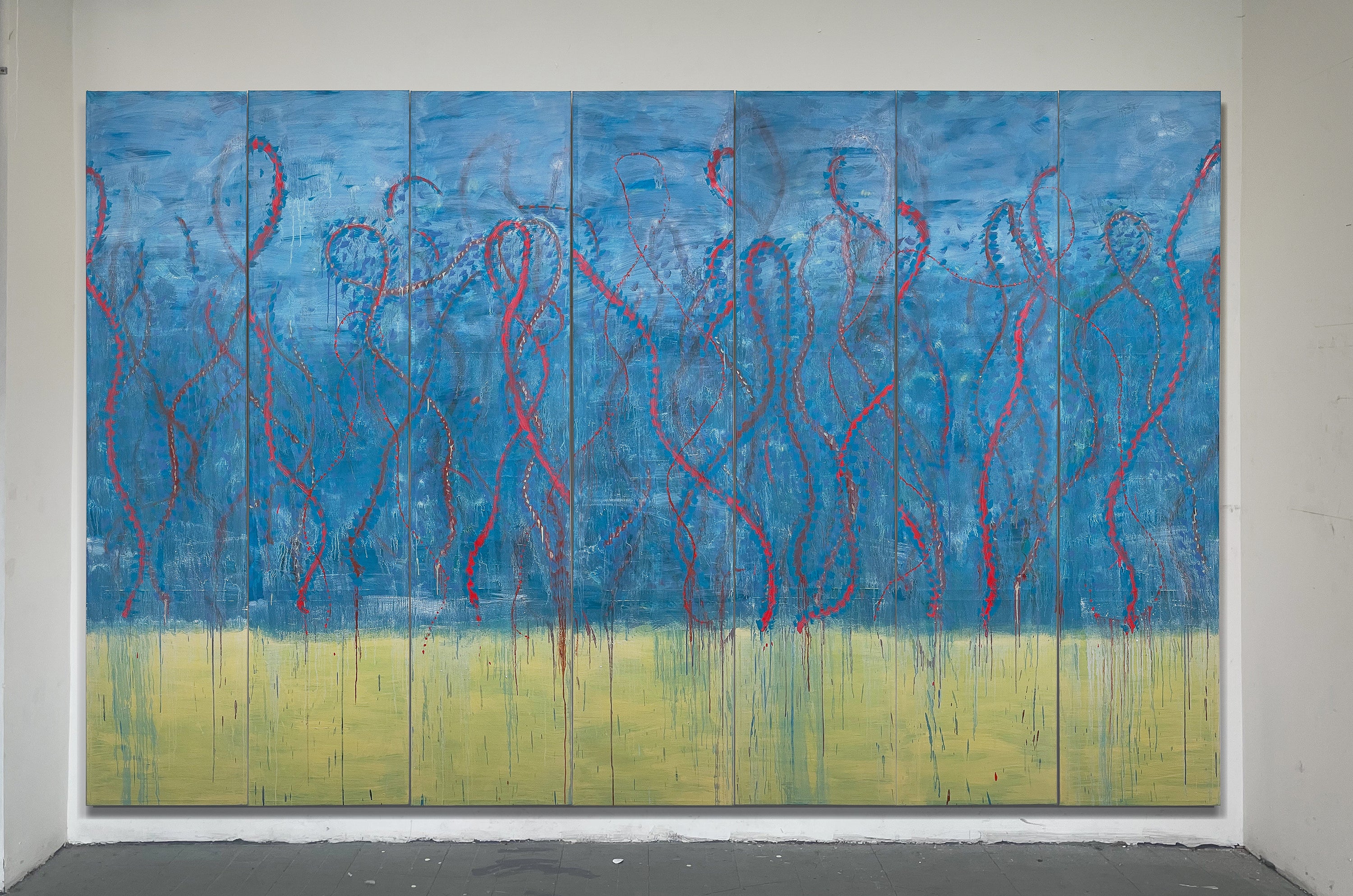Large seven-panel abstract painting with an atmospheric blue upper field and pale yellow lower band, crossed by red and brown looping lines, drips, and visible seams.