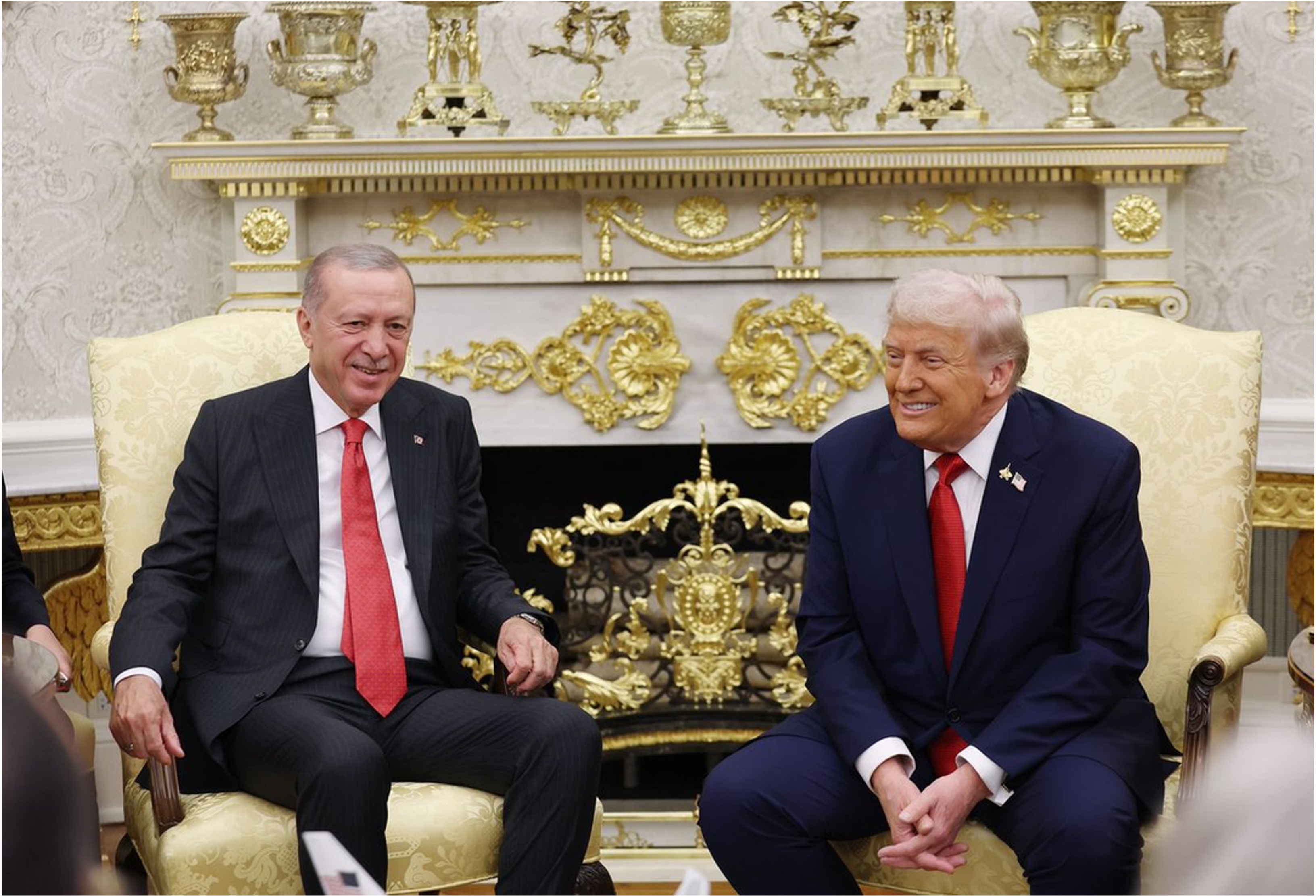 Erdoğan and Trump in Oval Office, gold ornamentation in the background.