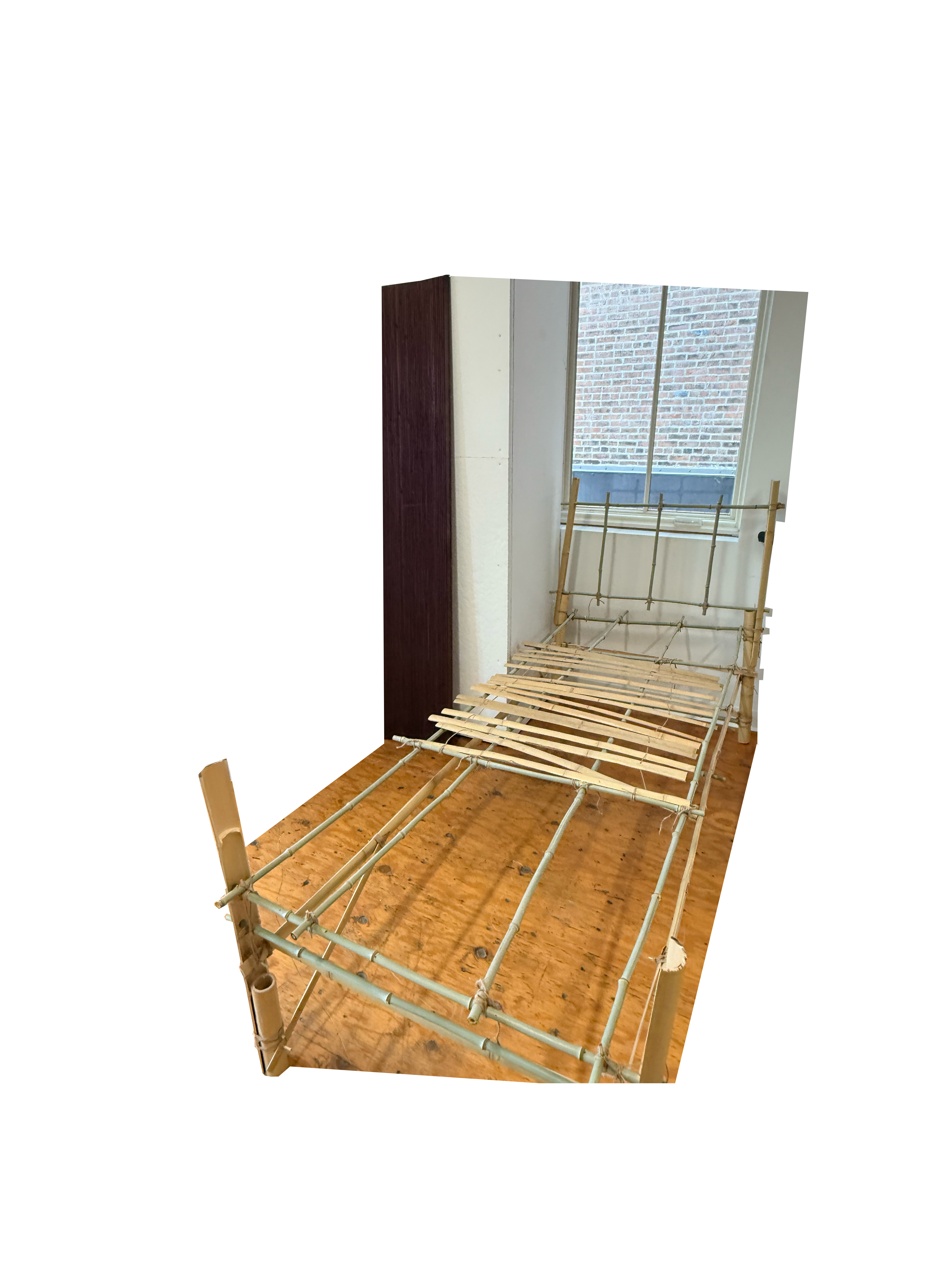 It is a conceptual bed made of bamboo poles with chopsticks used as joint connectors and linen cords used to lash the joints together.