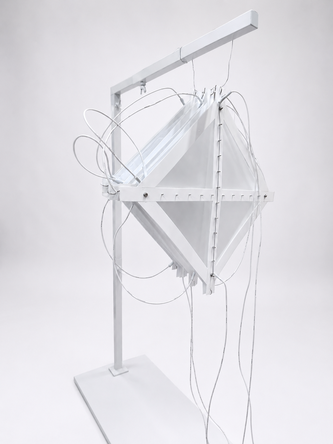 An assembly of eight Amphimorph surfaces with diagonally embedded Nitinol wire, joined together in an accordion-like configuration.