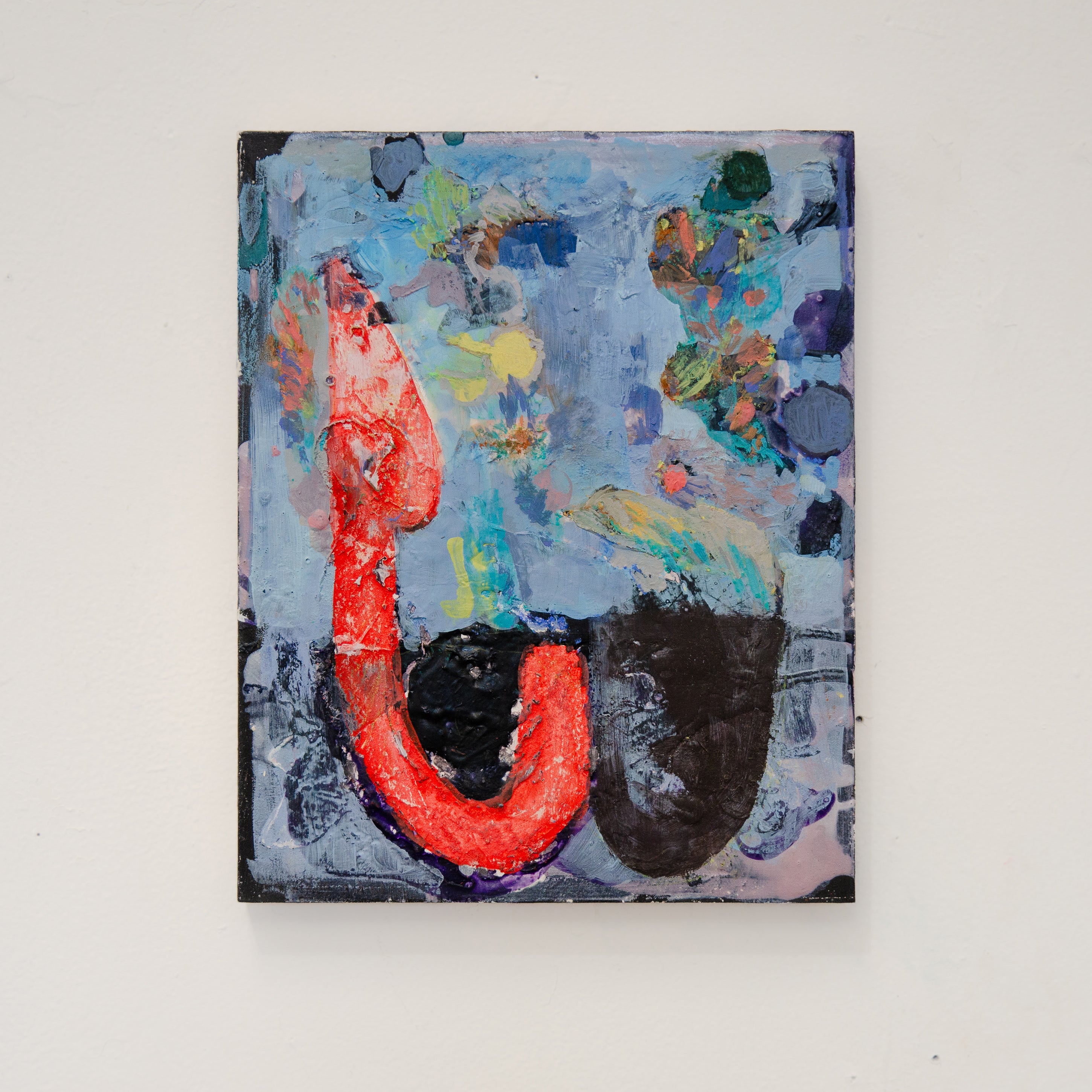 A red hook-like shape stands on a blue field with colorful feather-like paint marks and two dark bowl shapes on the bottom.