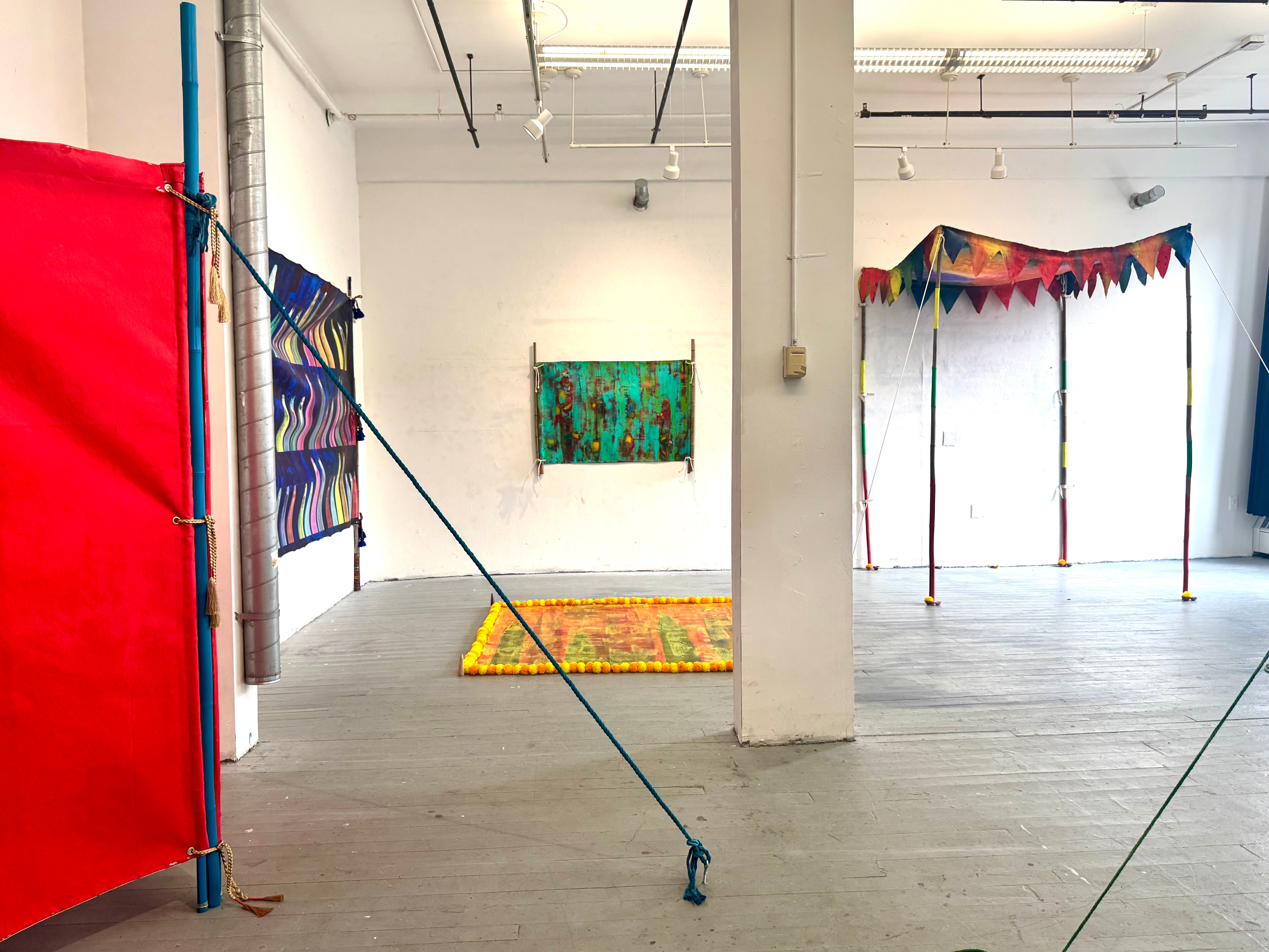This image displays an Installation view. a deconstructed wedding tent, contains multiple pieces. 