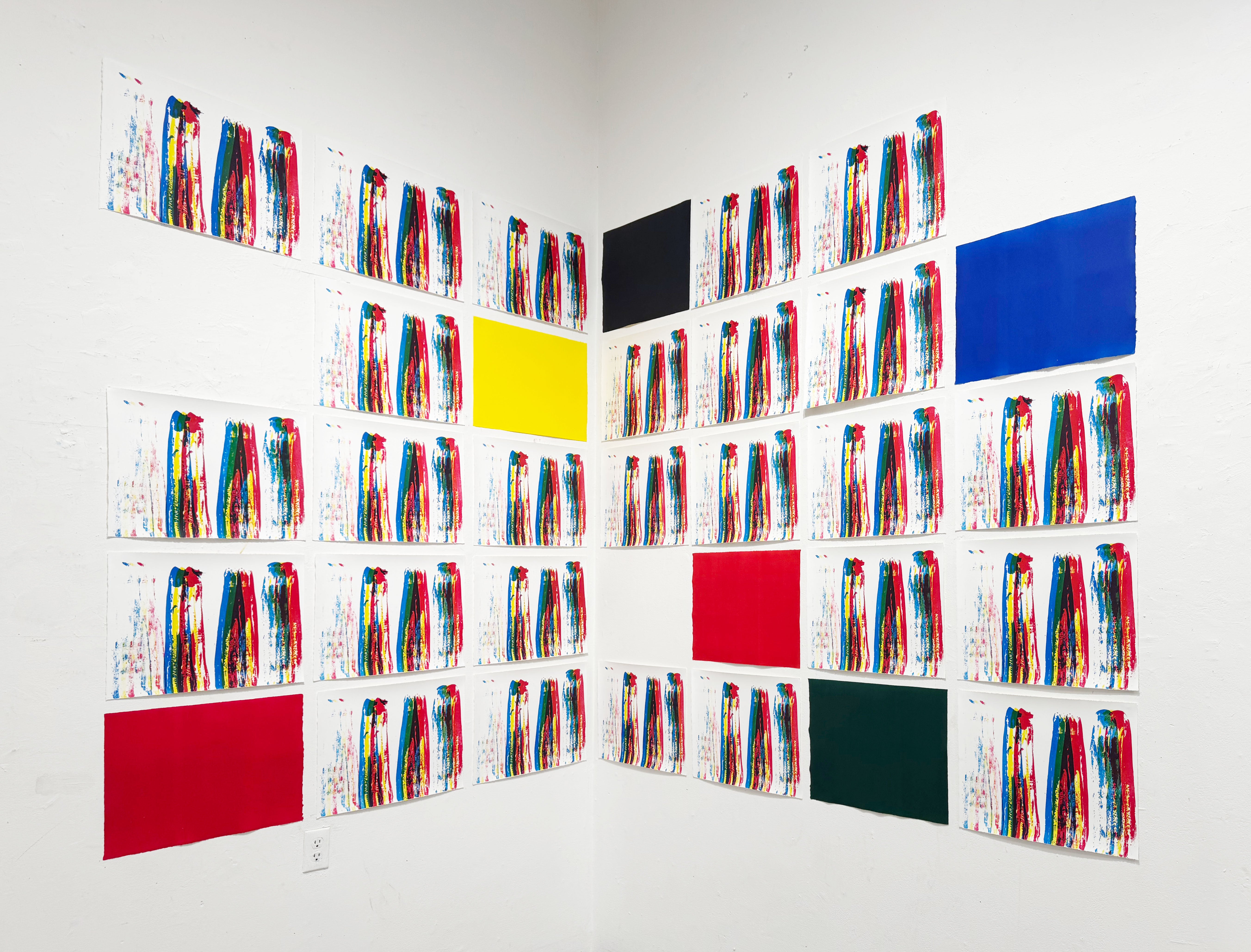 its an installation of prints, in the corner of the room, placed in a grid on each wall.