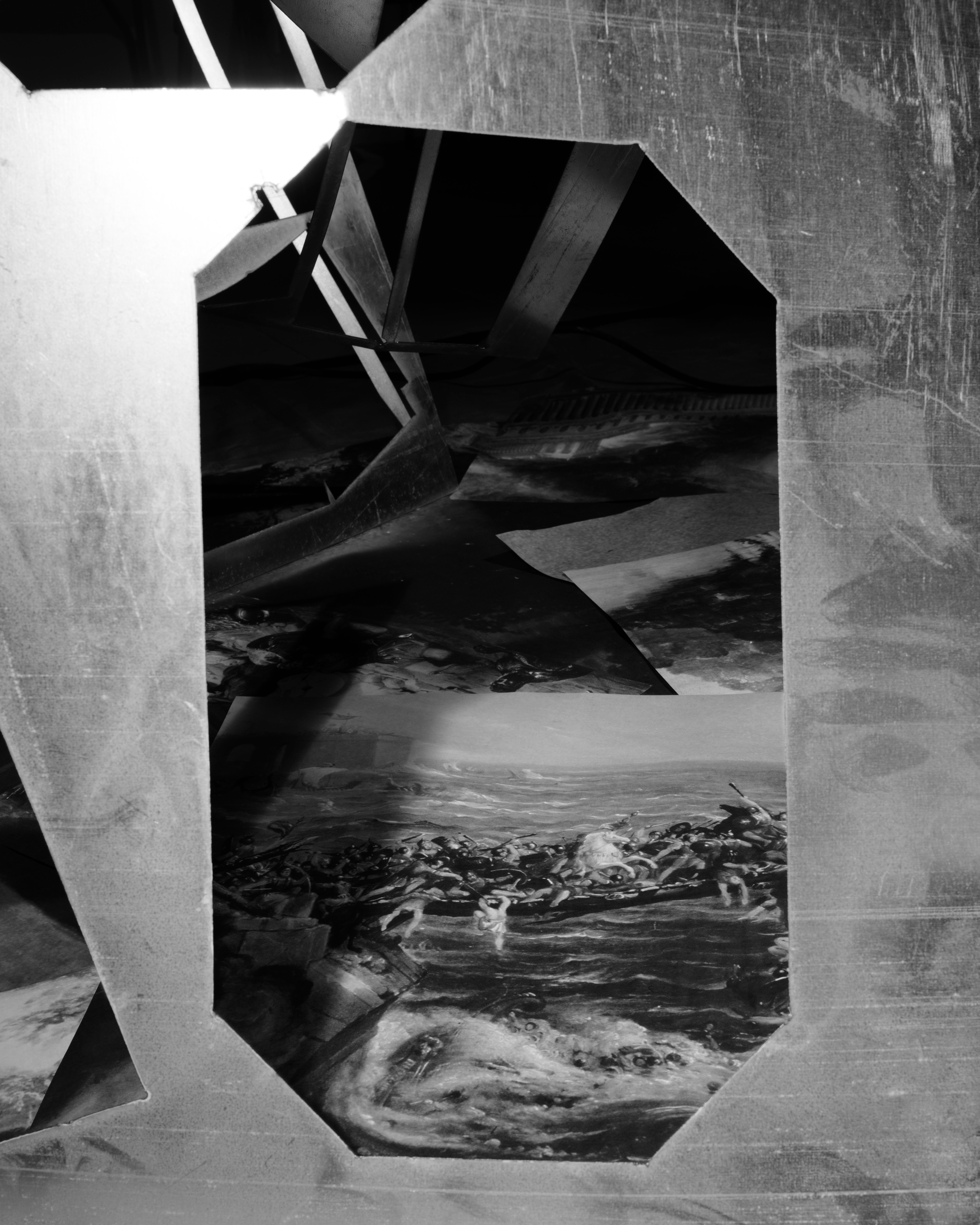Photograph of a collage made of paper prints from 19th century landscape painting layered with pieces of discarded sheet metal.