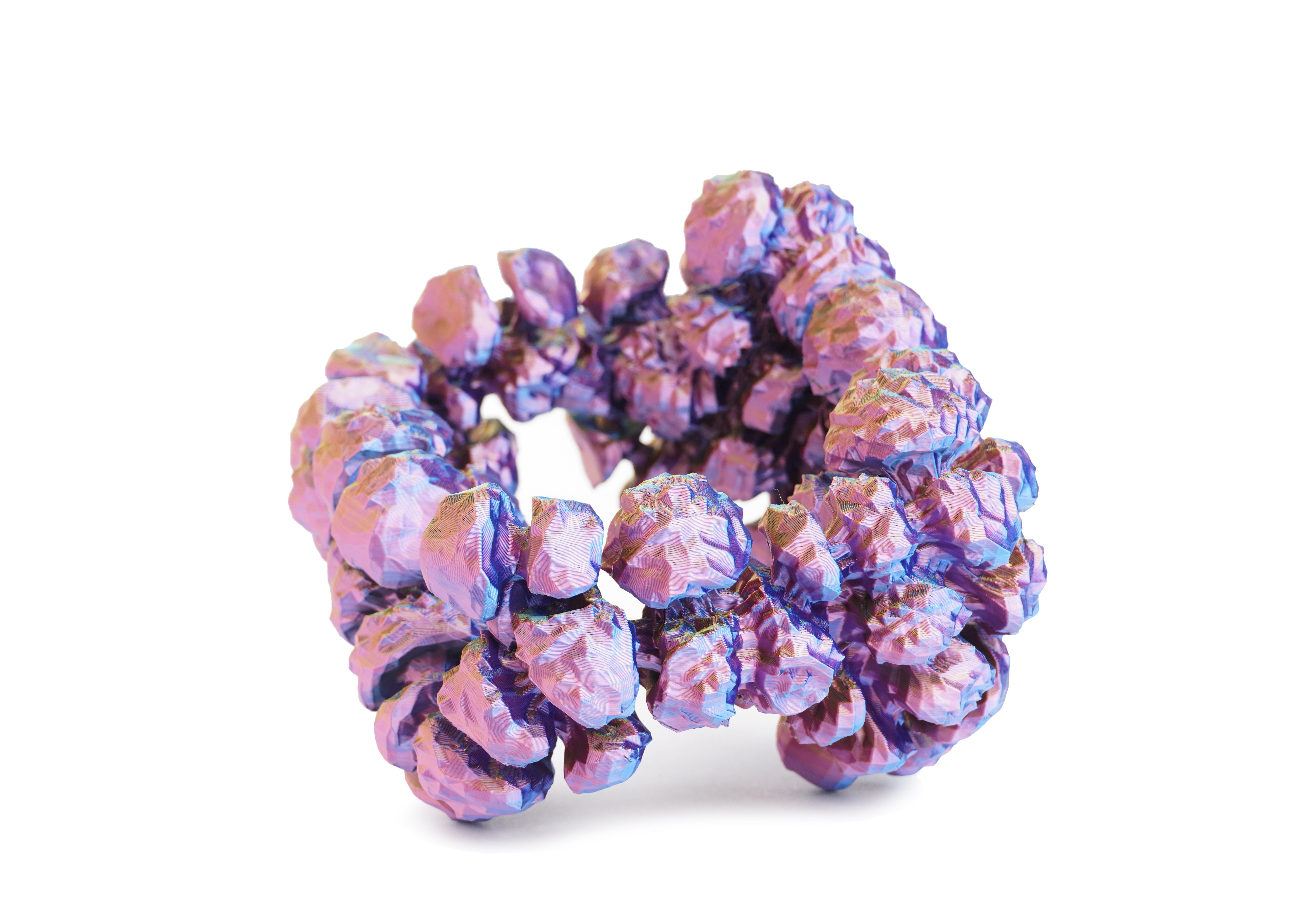 Iridescent purple and pink arm cuff built from clustered rounded volumes that swell outward in a band.