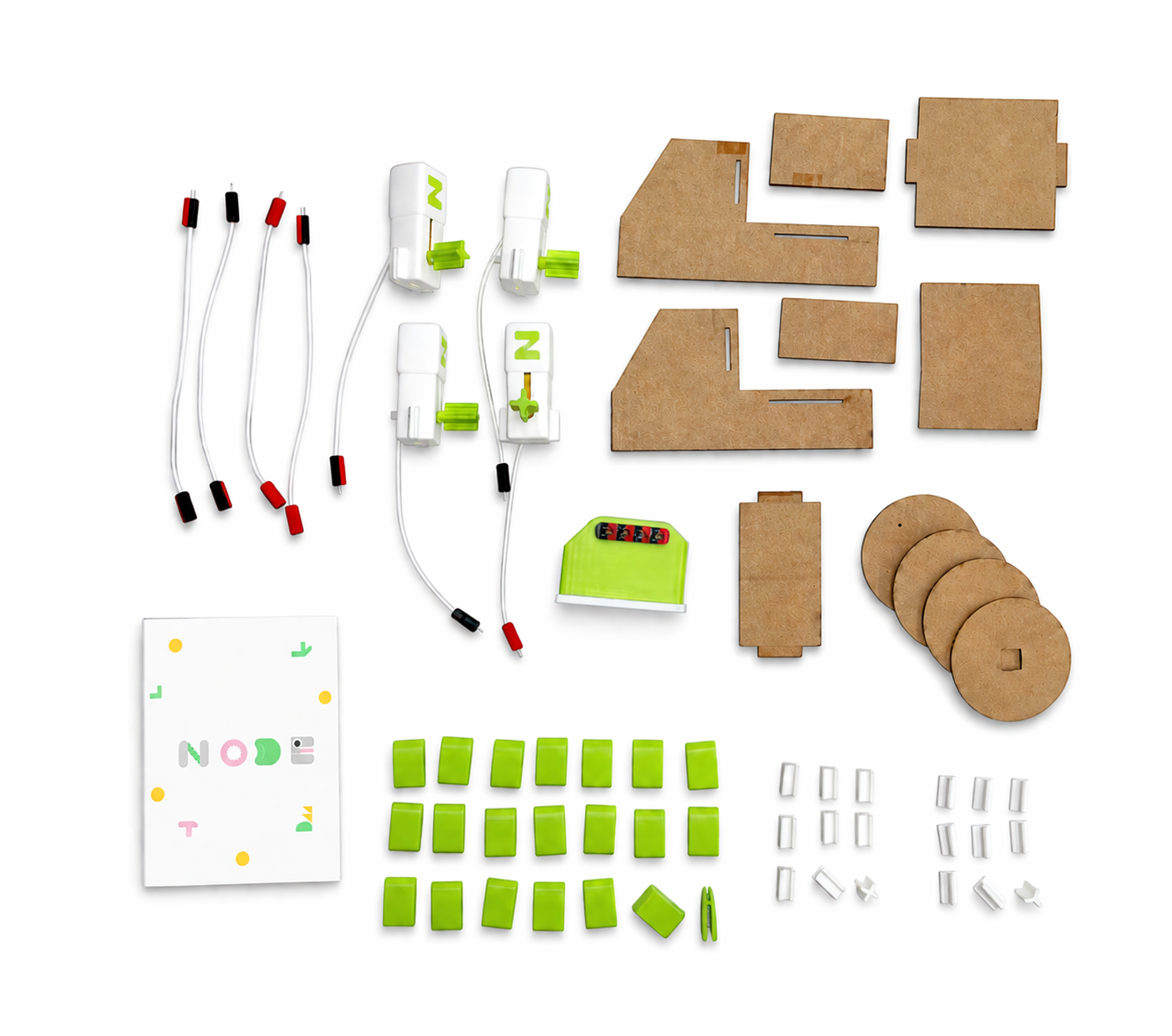 NODE kit components laid out on a table, including motors, cardboard parts, connectors, and instruction booklet.
