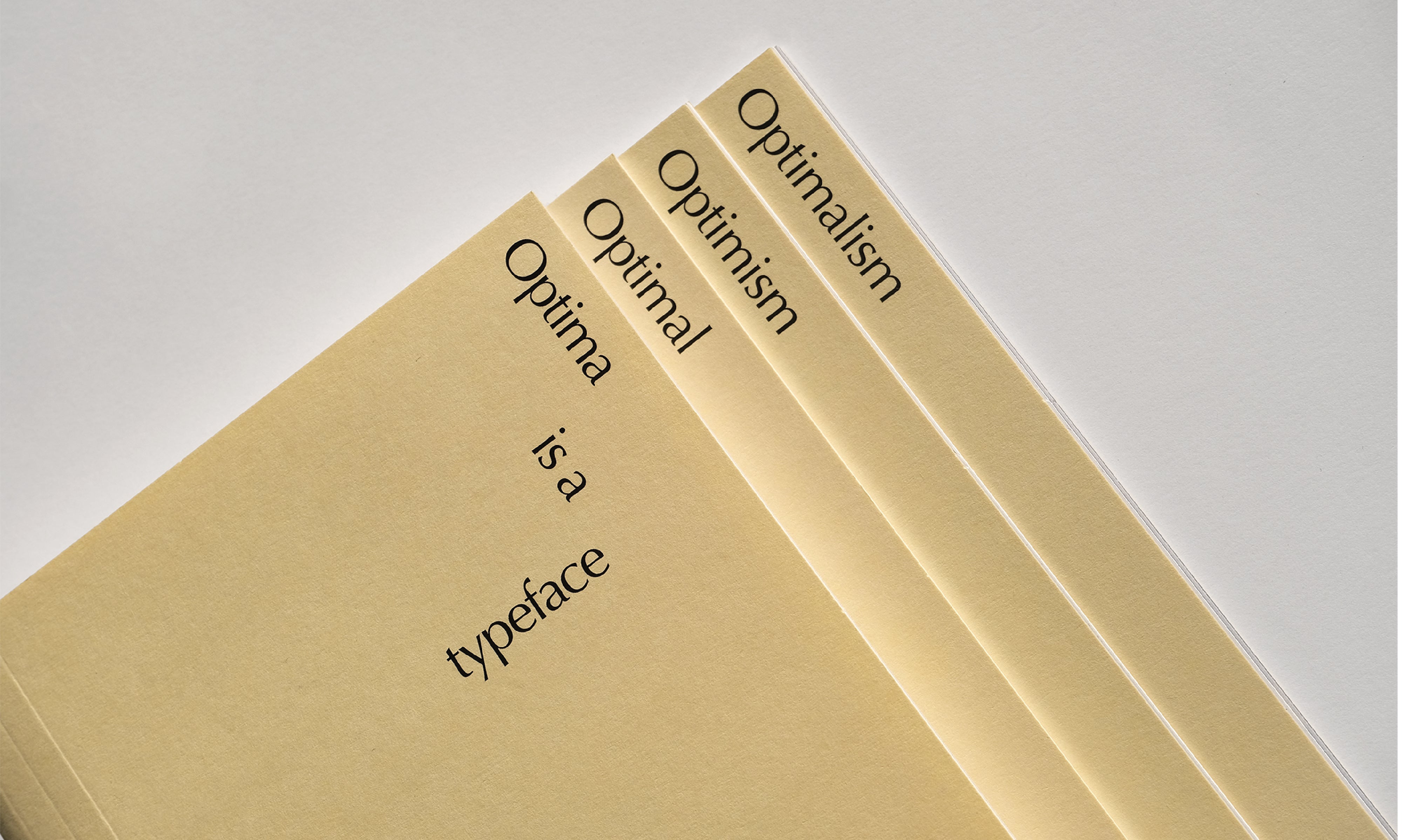 Photo of Optimalism thesis book, sections printed on store-bought manila folders, exposed as book cover.