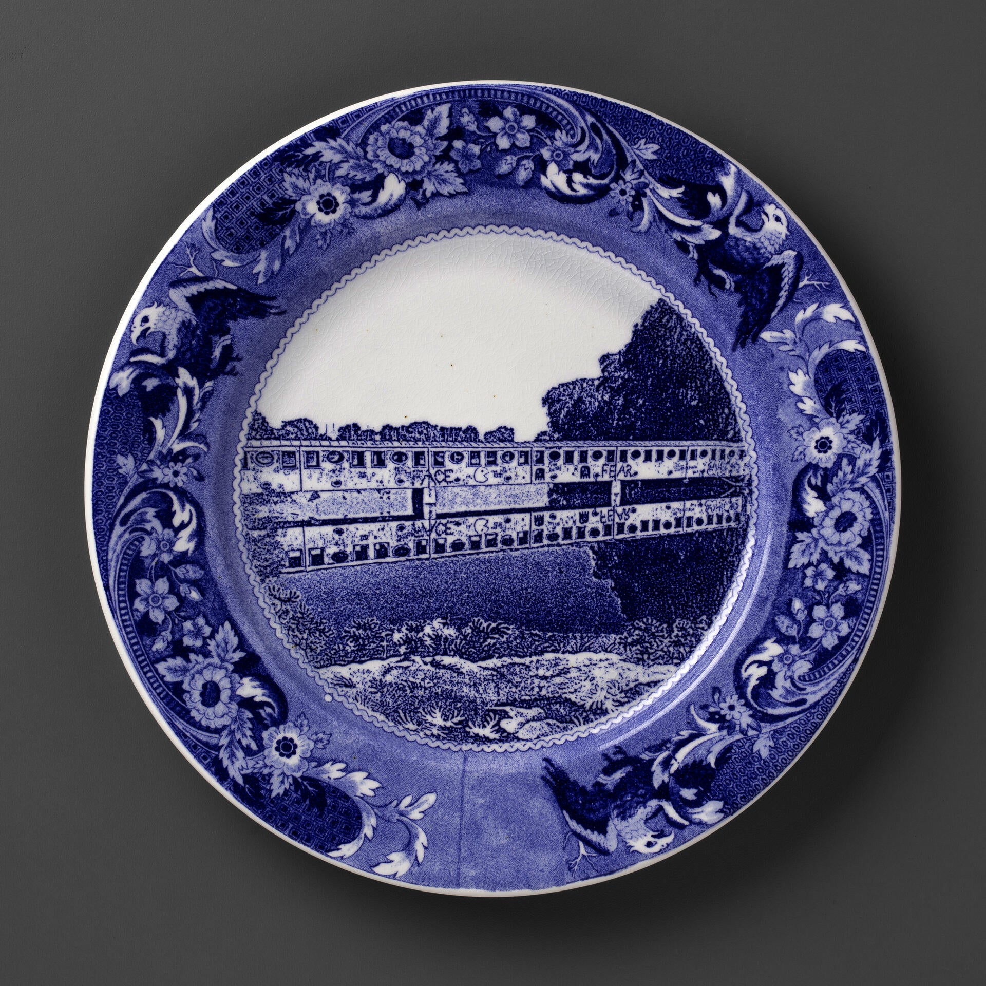 blue and white transferware plate depicting a covered bridge in Detroit