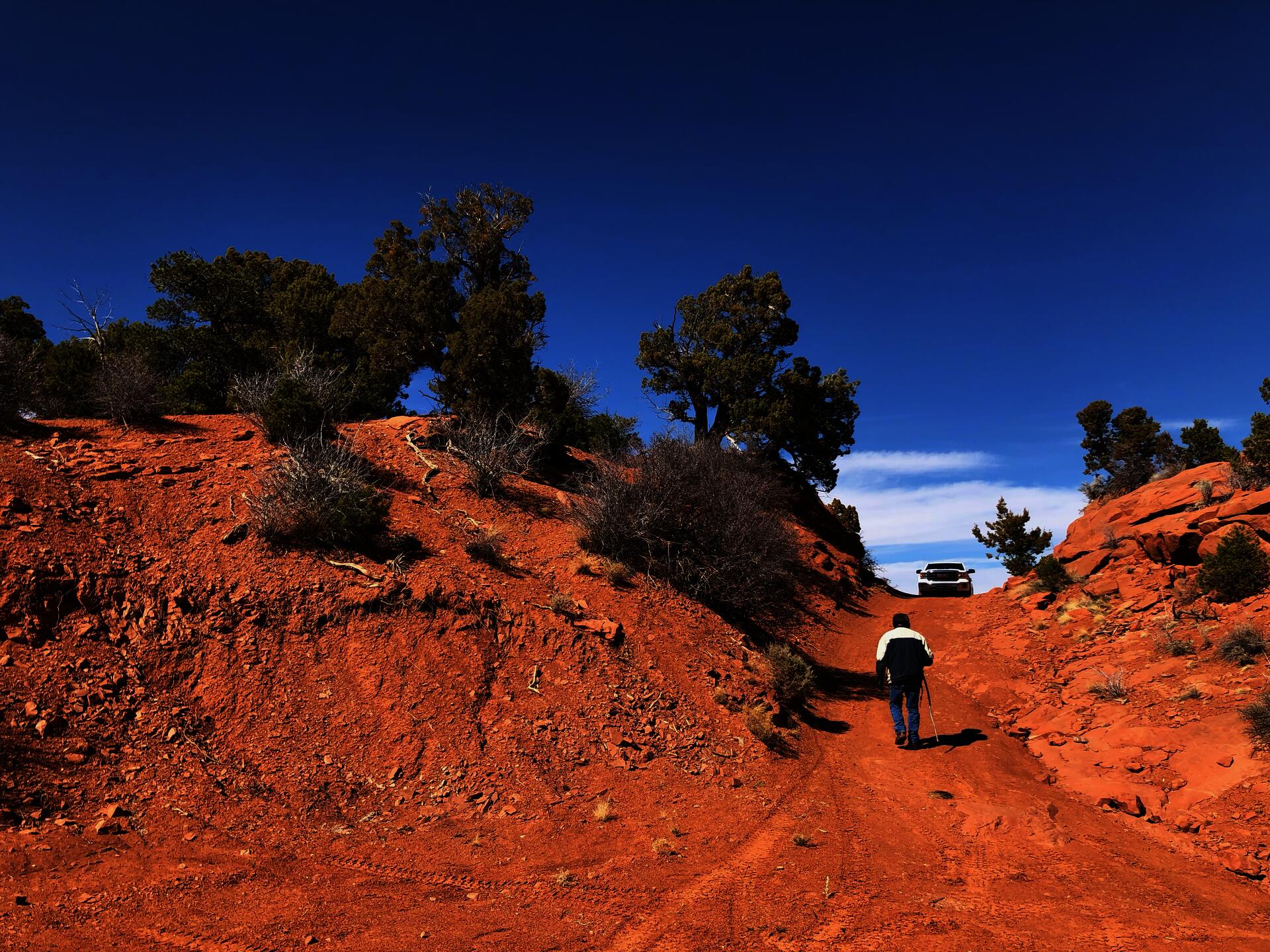 landscape near Cove, AZ, with Timothy Benally walking up to his truck