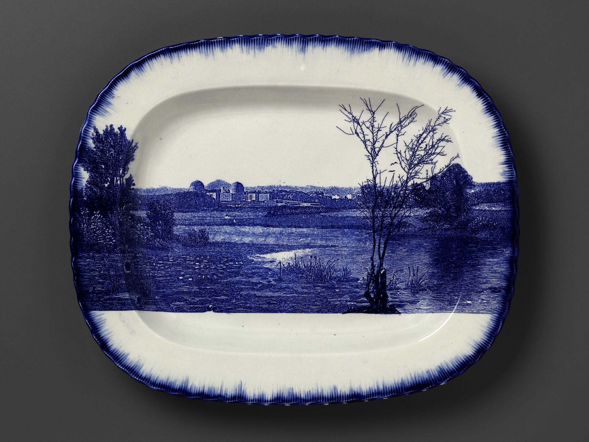 blue and white transferware platter with the Indian Point power station