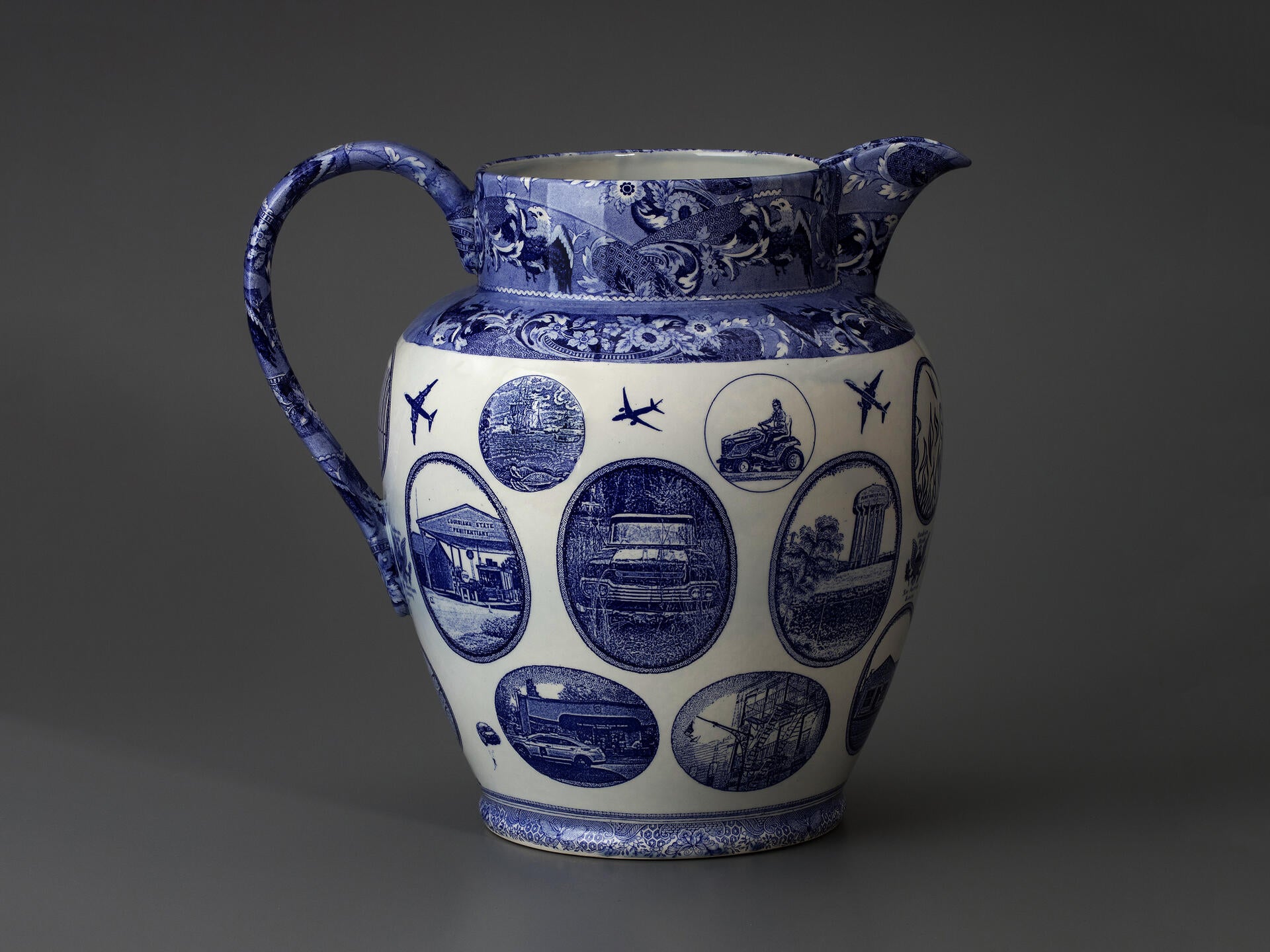 blue and white transferware jug with many vignettes