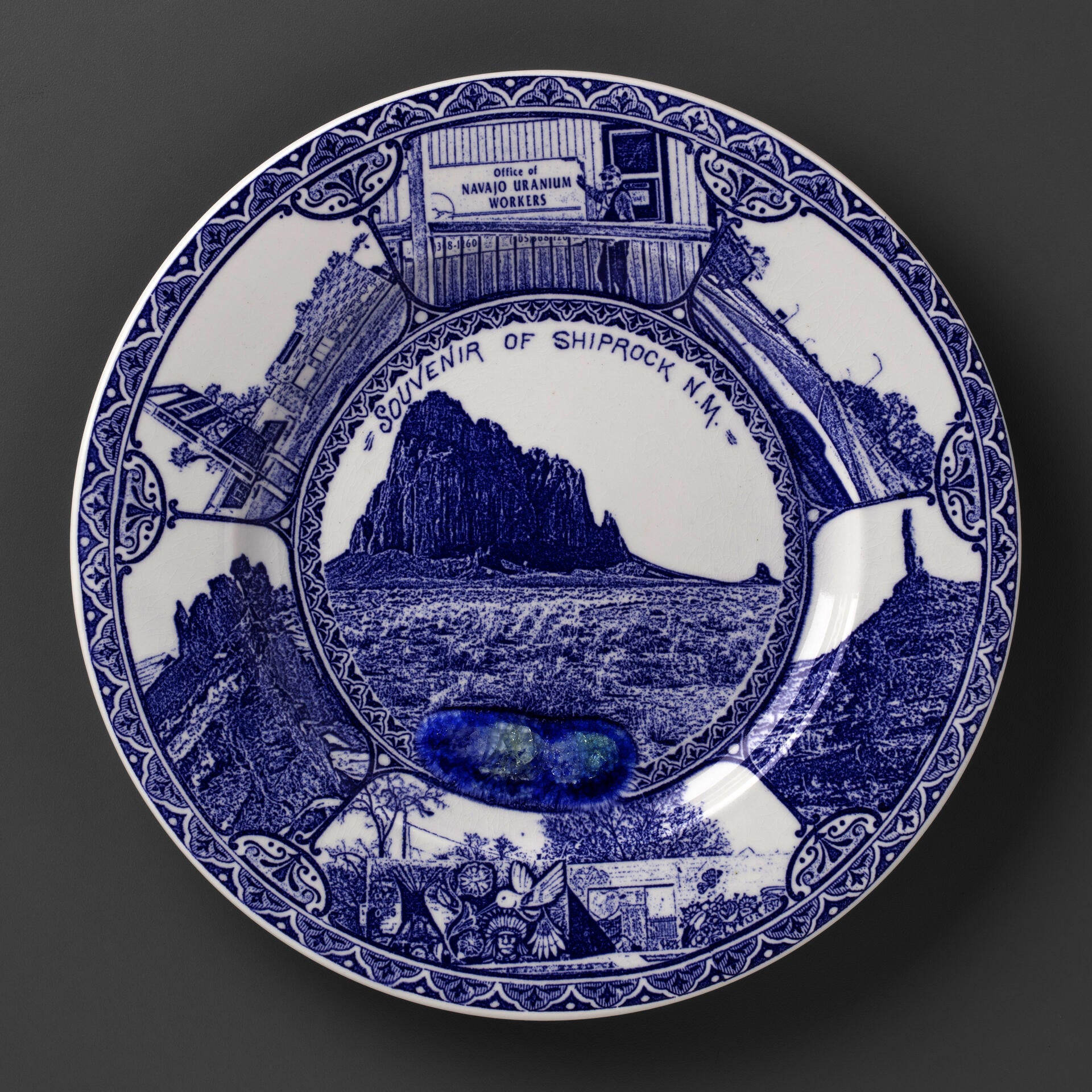 blue and white transferware plate depicting a scenes near Shiprock, NM