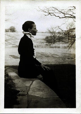Nancy Elizabeth Prophet wearing black with clouds in the background
