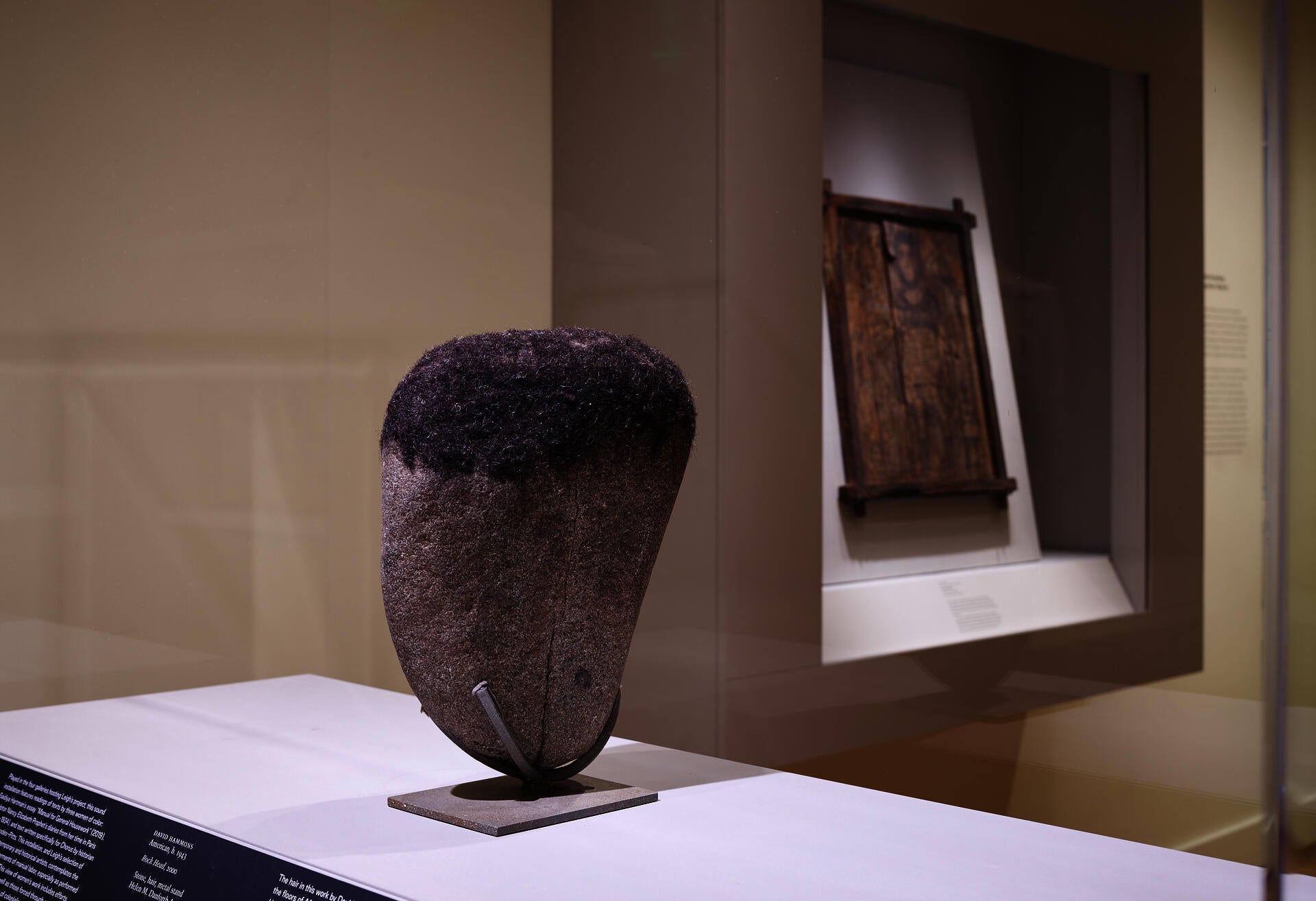 Installation shot of David Hammons "Rock Head" sculpture on view in the Egyptian gallery