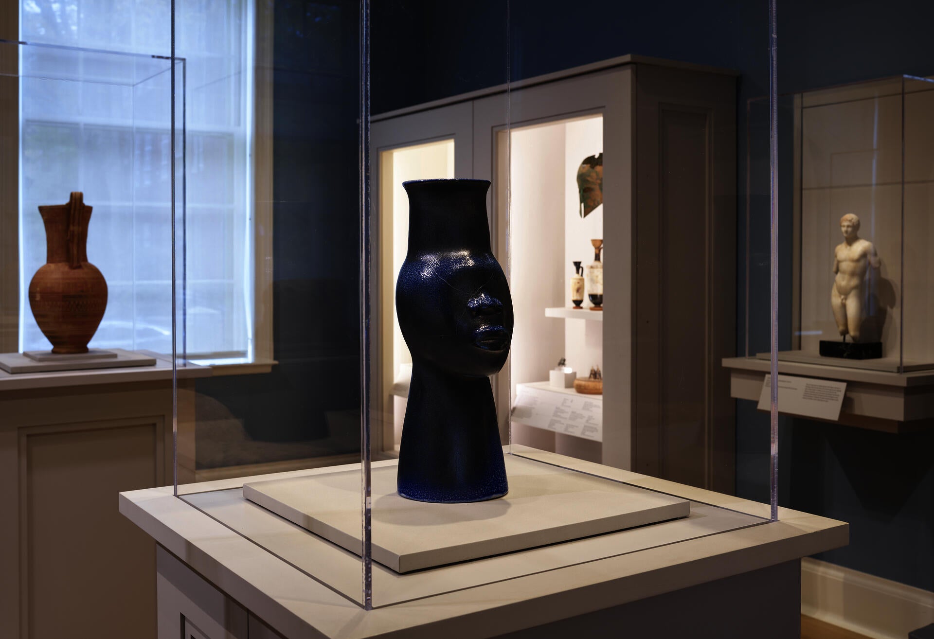 Installation shot of Simone Leigh "108 (Face Jug Series)" sculpture on view in the Greek and Roman gallery