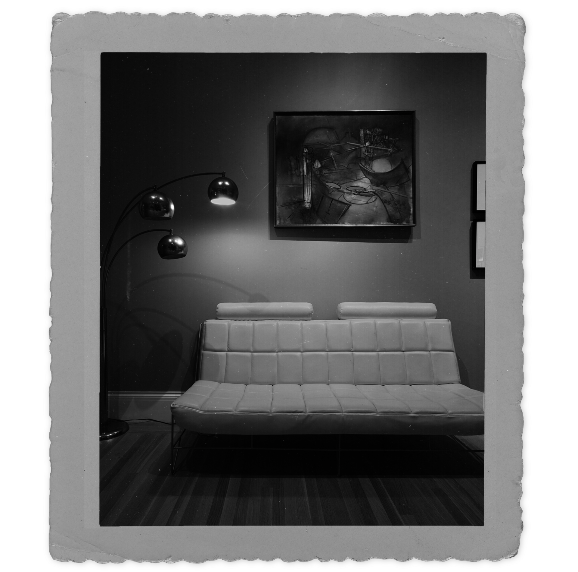 "Old" photograph of a painting by Roberto Matta, hanging above a mid-century modern couch