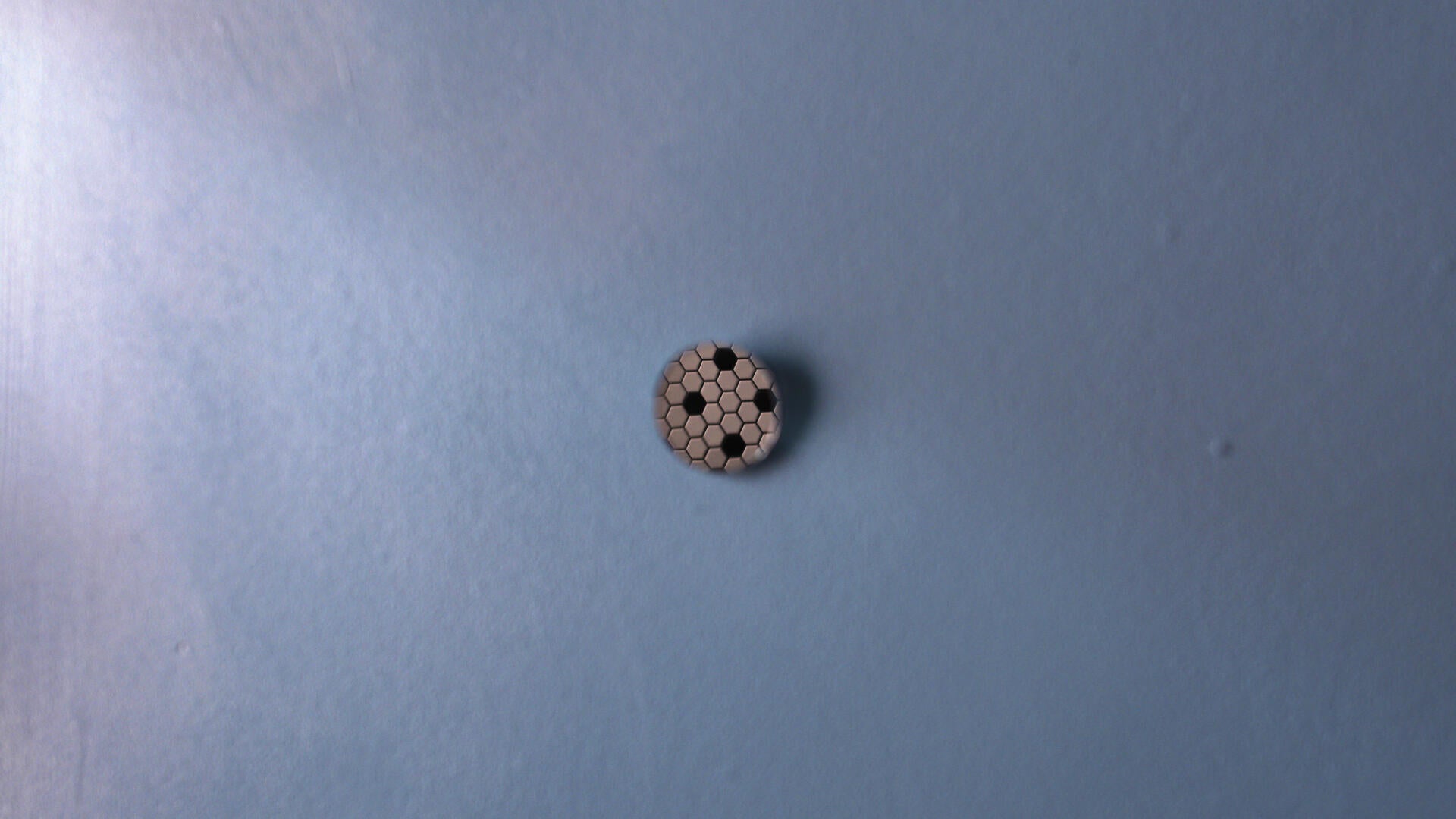 Untitled (Studio) still, small circular mirror on blue wall