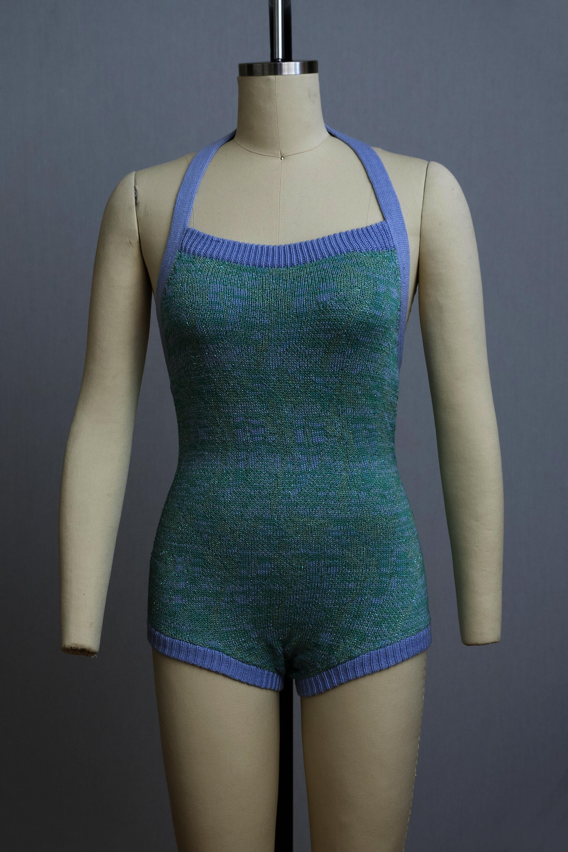 dress form wearing a knit playsuit in blues and lavendar