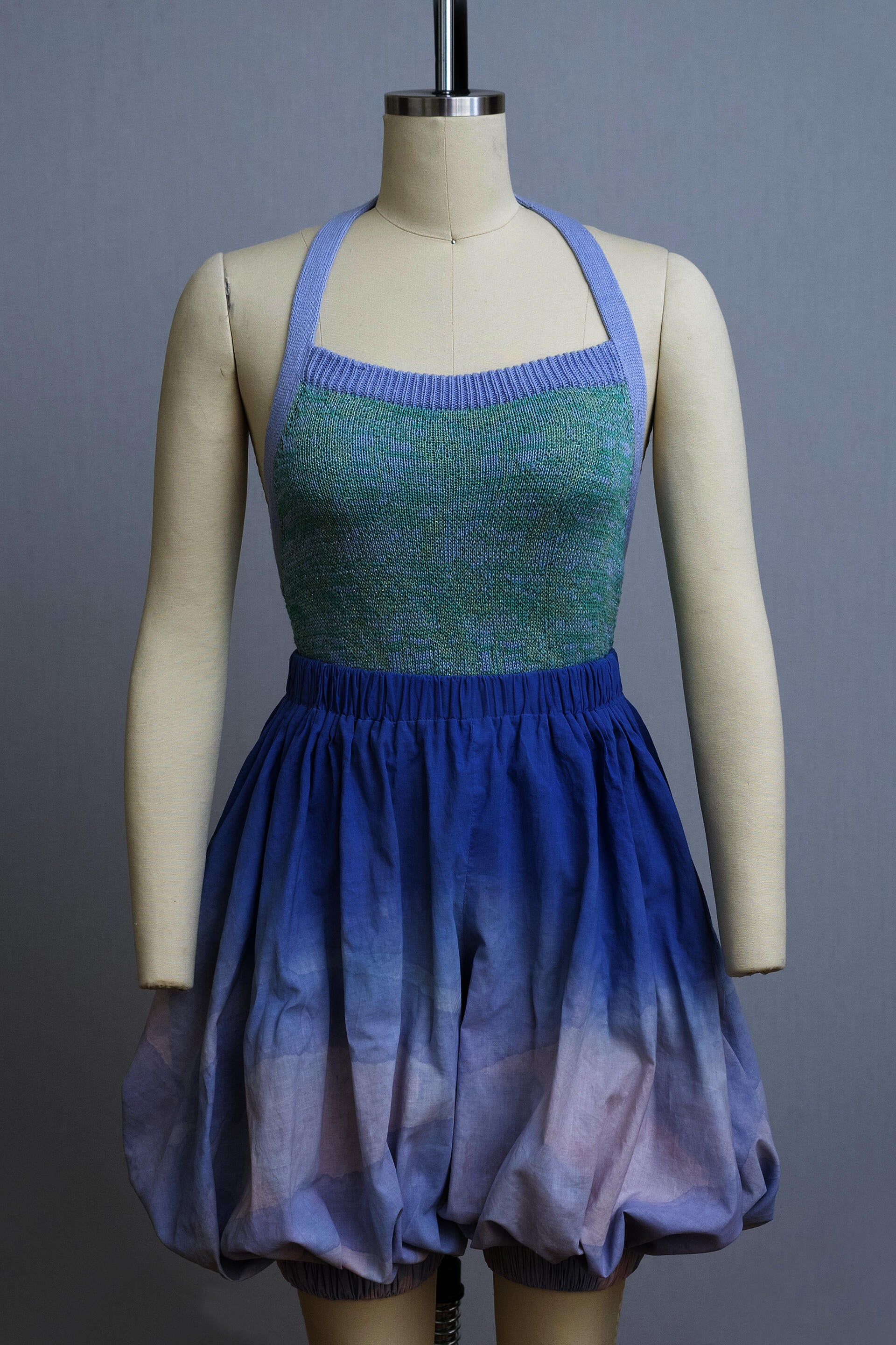 dress form wearing a knit playsuit and bloomers dyed in an ombre from blue to lavendar