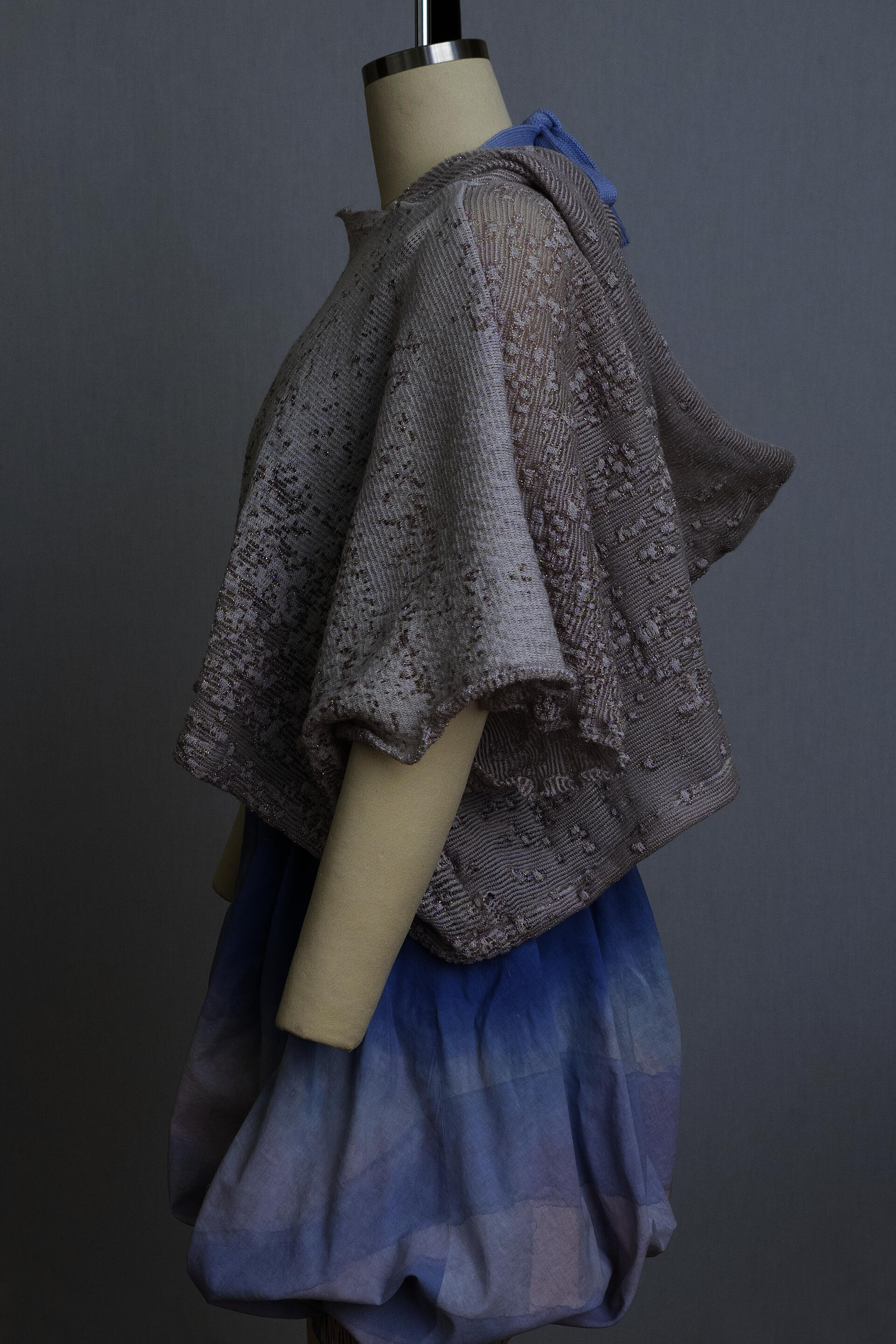dress form wearing bloomers and a grey knit hooded sweater