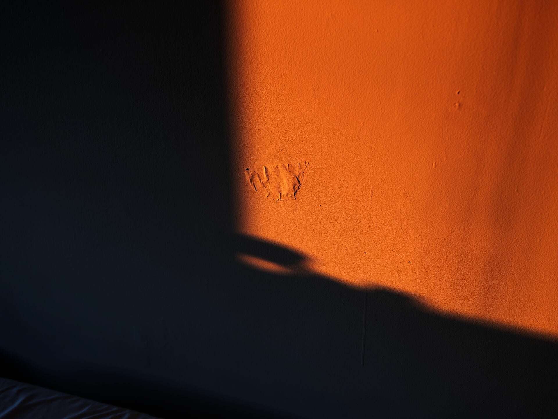 mark on bedroom wall with sunlight