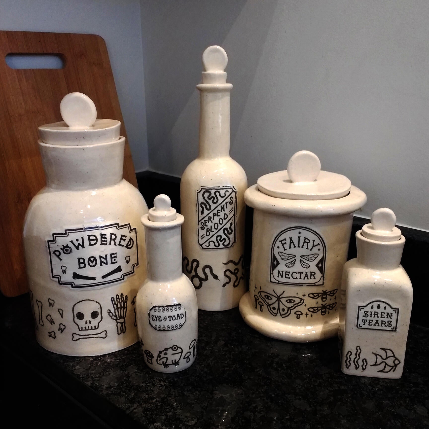 A set of ceramic vessels inspired by apothecary jars and a play on kitchen container sets.