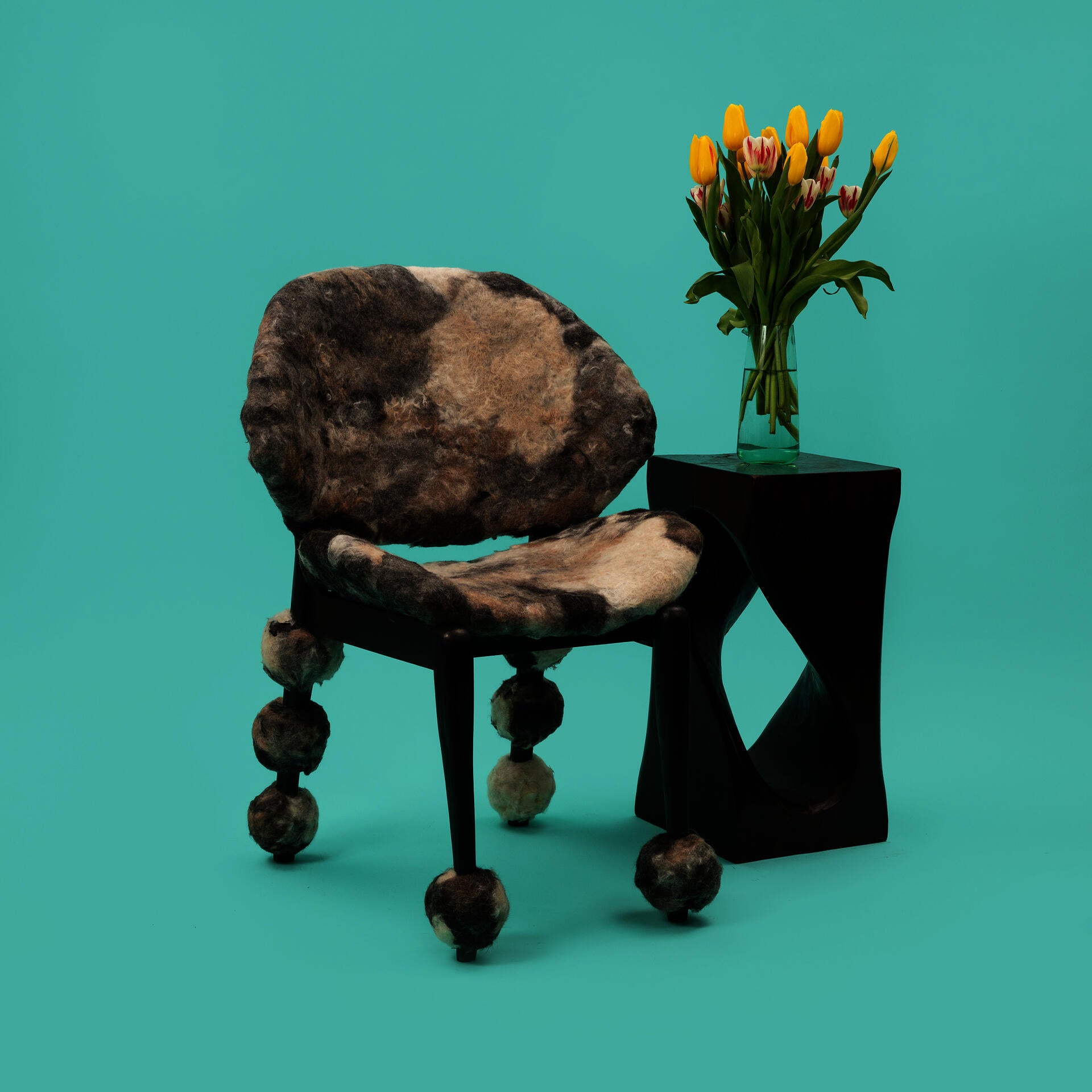 Wooden chair upholstered with handmade felt made from dog hair.