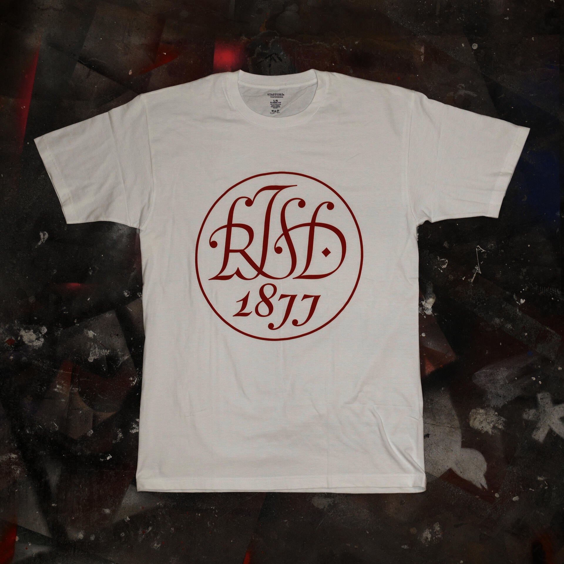 T-shirt design with a holiday version of the original "RISD 1877" seal designed by John Howard Benson