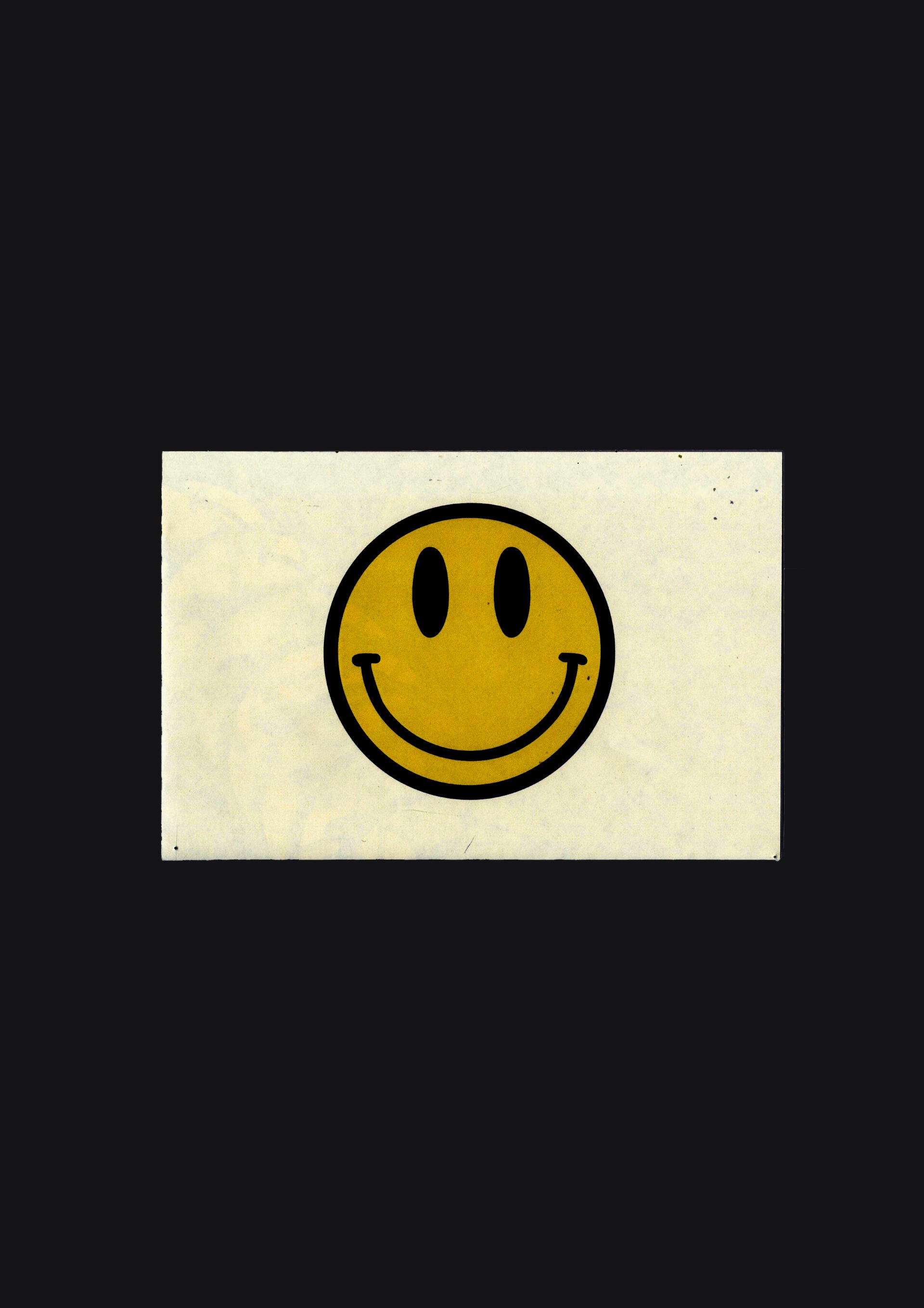 Smiley face graphic with white rectangle behind