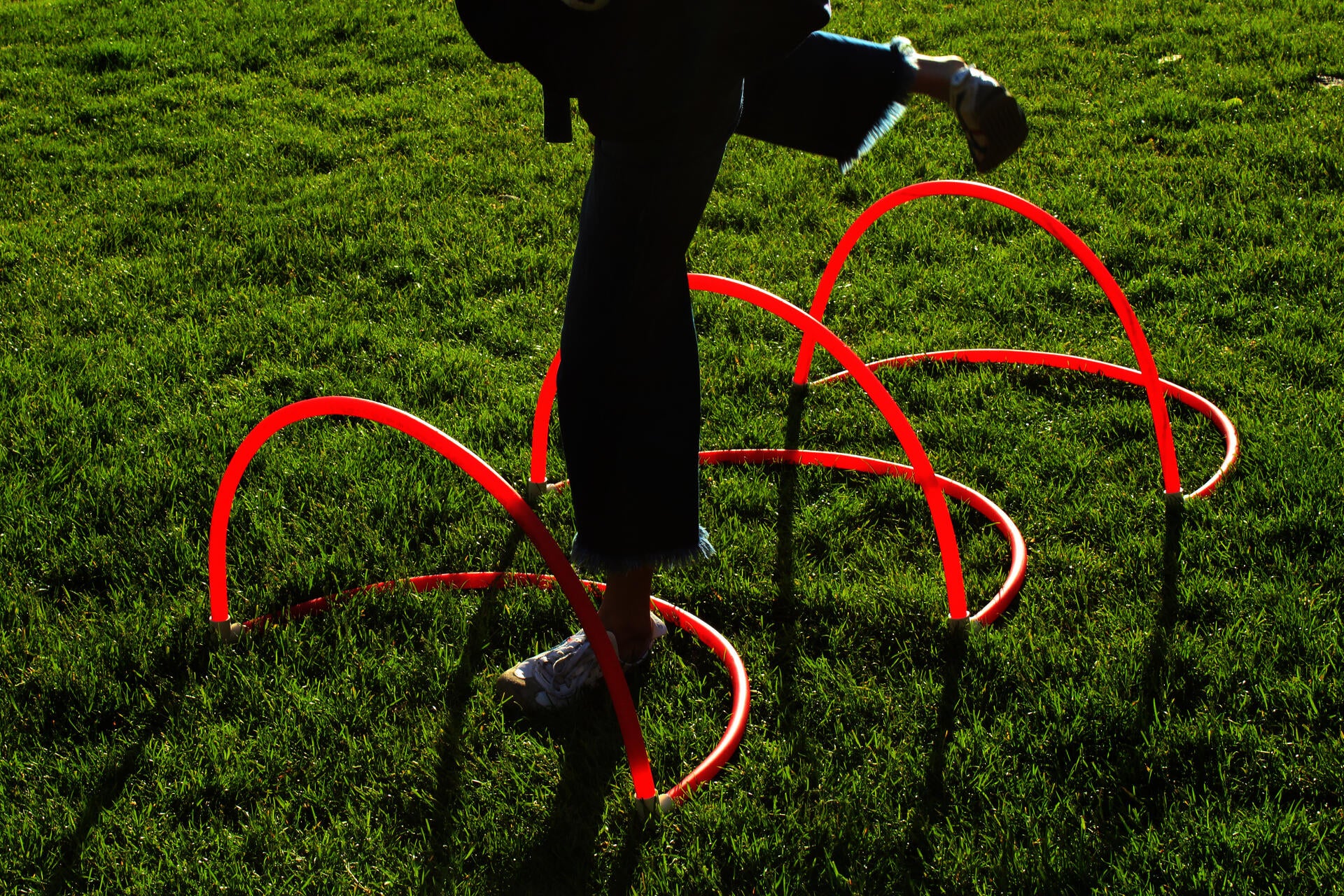 Photo of red PVC letterforms on grass
