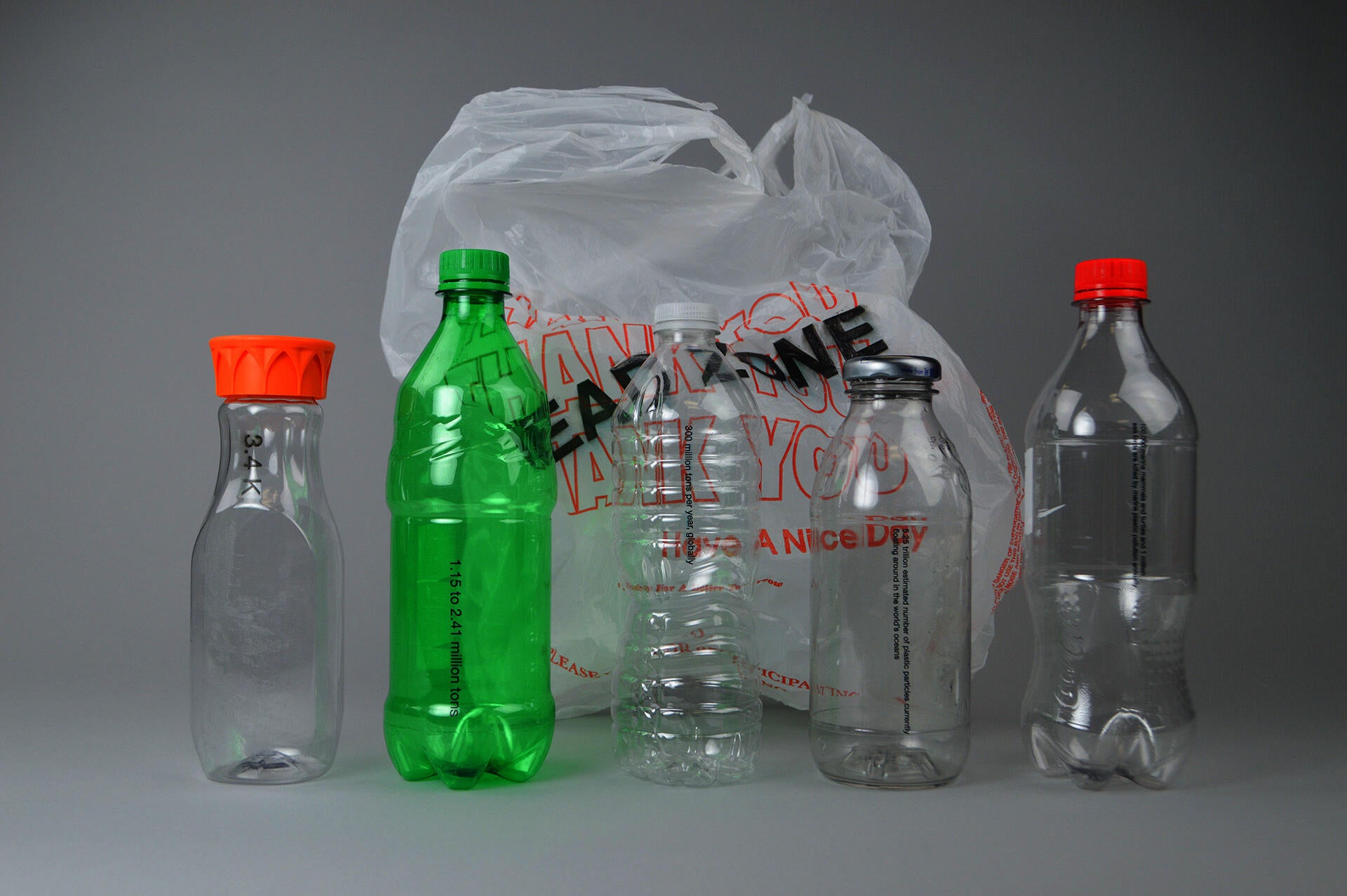 Five plastic bottles with a plastic bag behind them with the text 'Dead Zone' printed on it