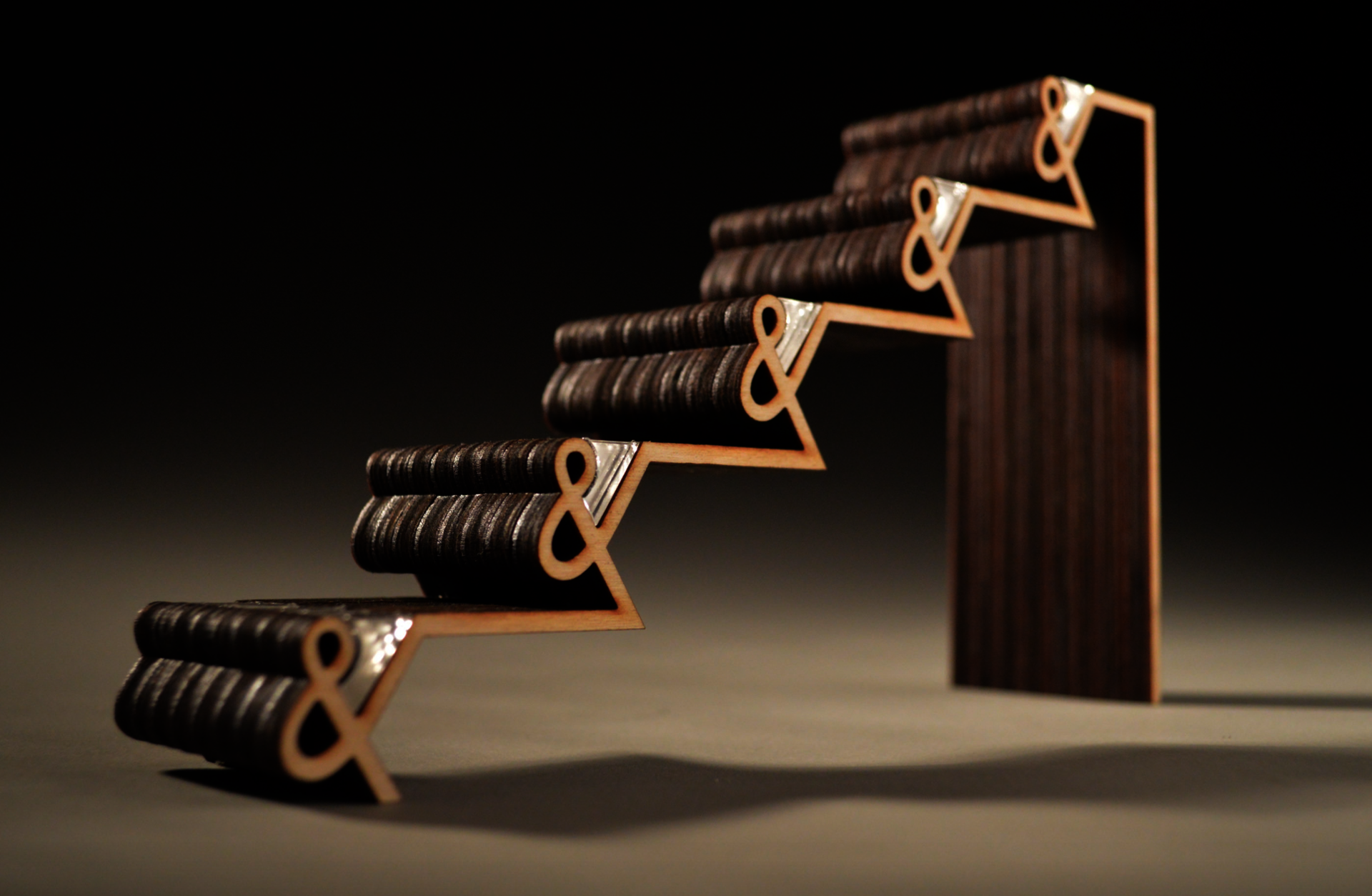 A wooden staircase built of ampersands