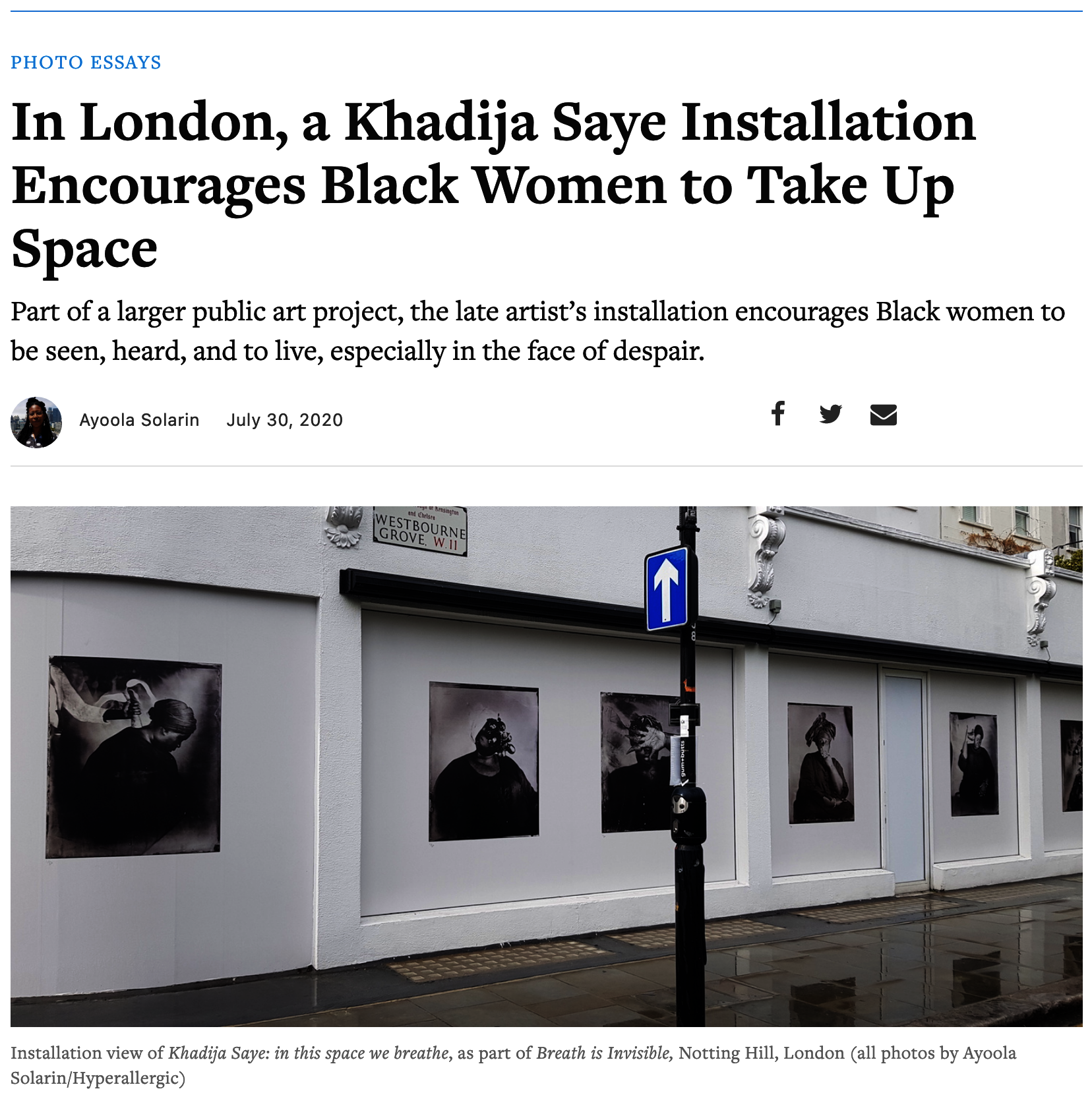 Black & white photographs of people on a wall