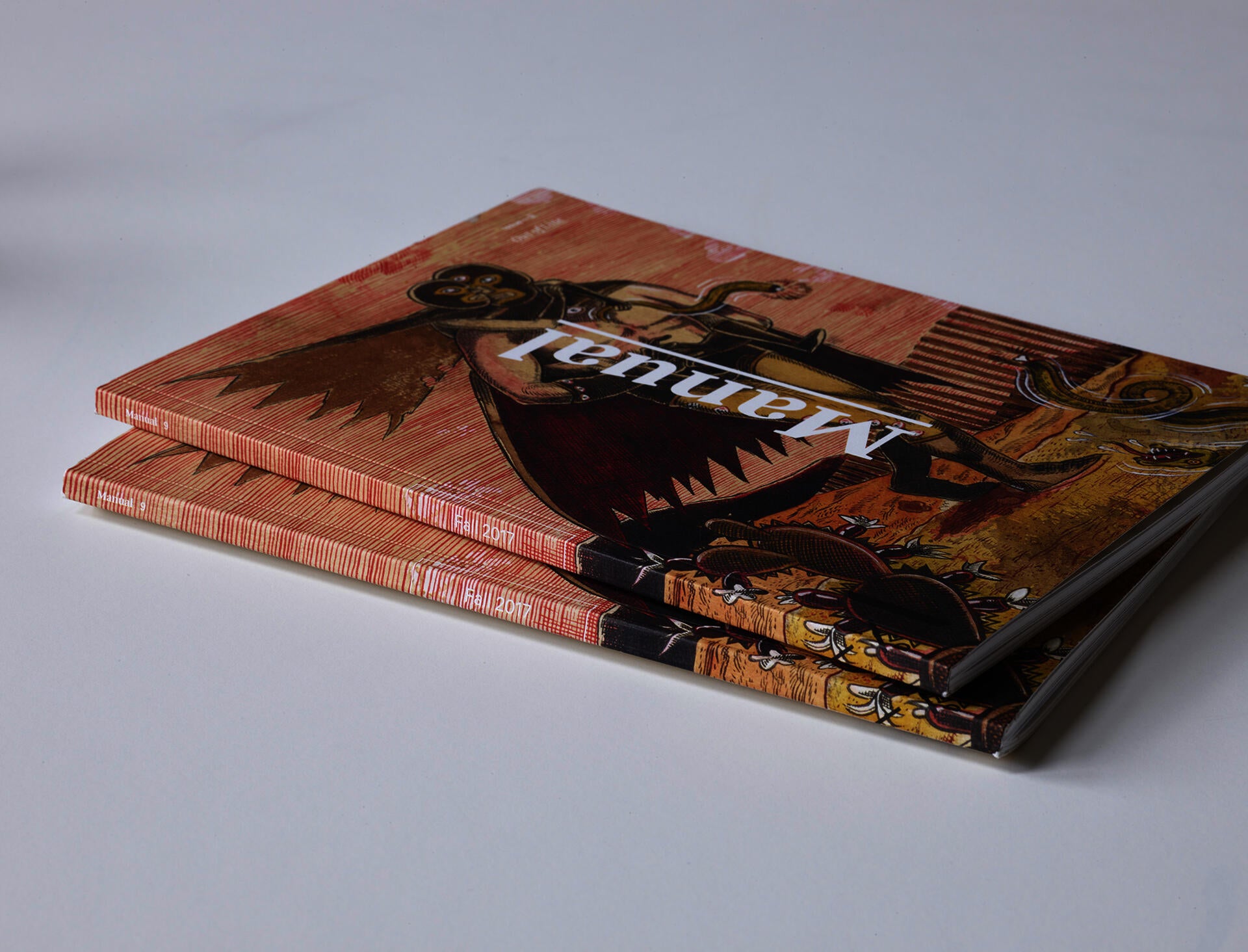 Photograph of a stack of issues of 'Manual'