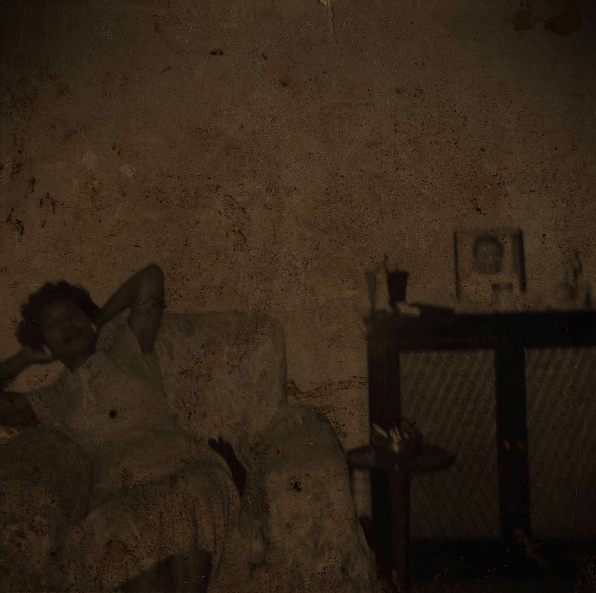 black and white snapshot of a Black woman relaxing in an easy chair