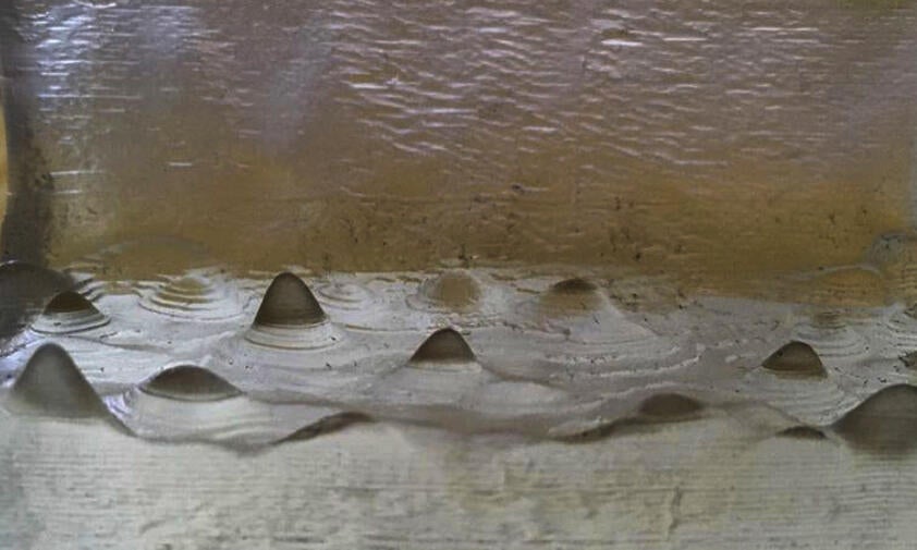 Resin 3D print of wave information analyzed with CAD software.