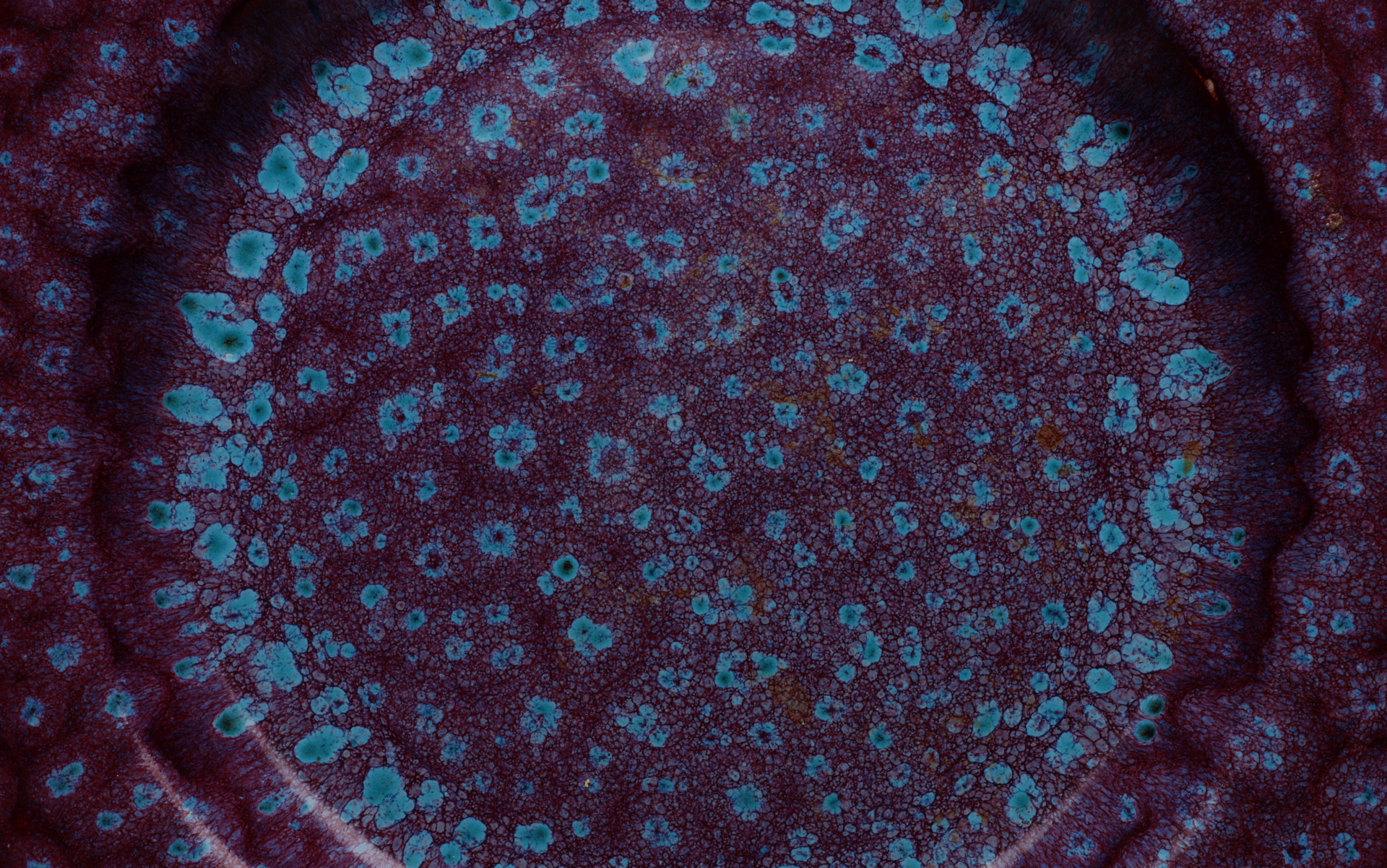 Detail of a purple and blue ceramic plate