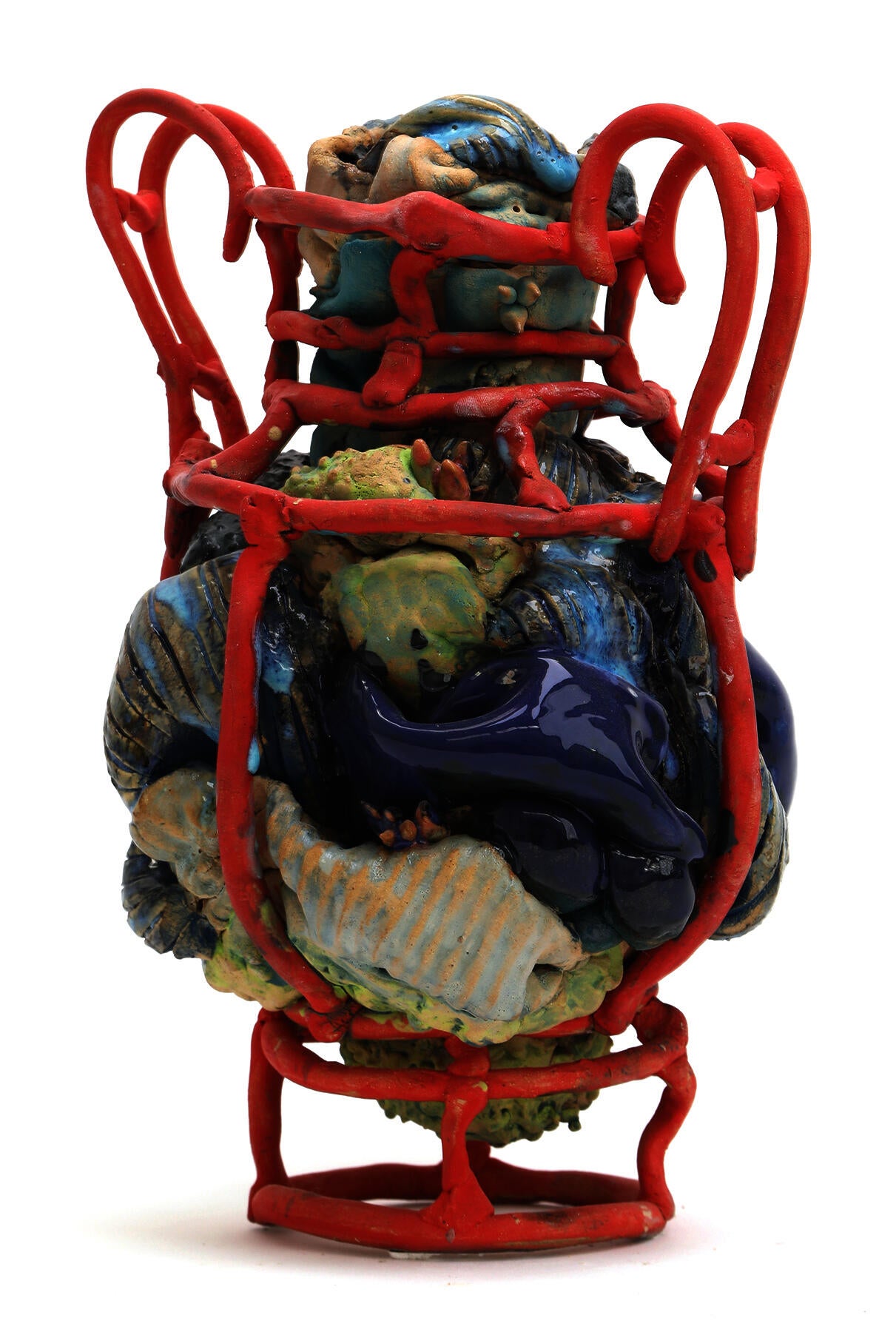 An amphora form made of red coils filled with gestural blue-green glazed clay sculpture.