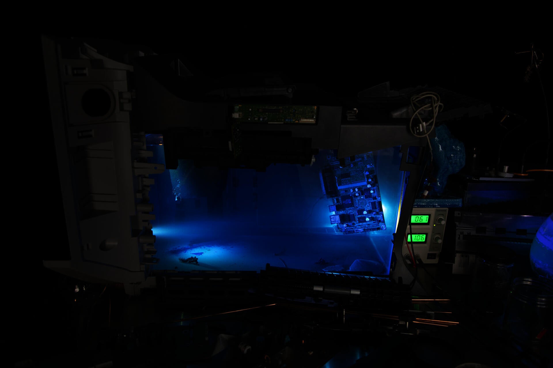 installation view, tank filled with blue liquid