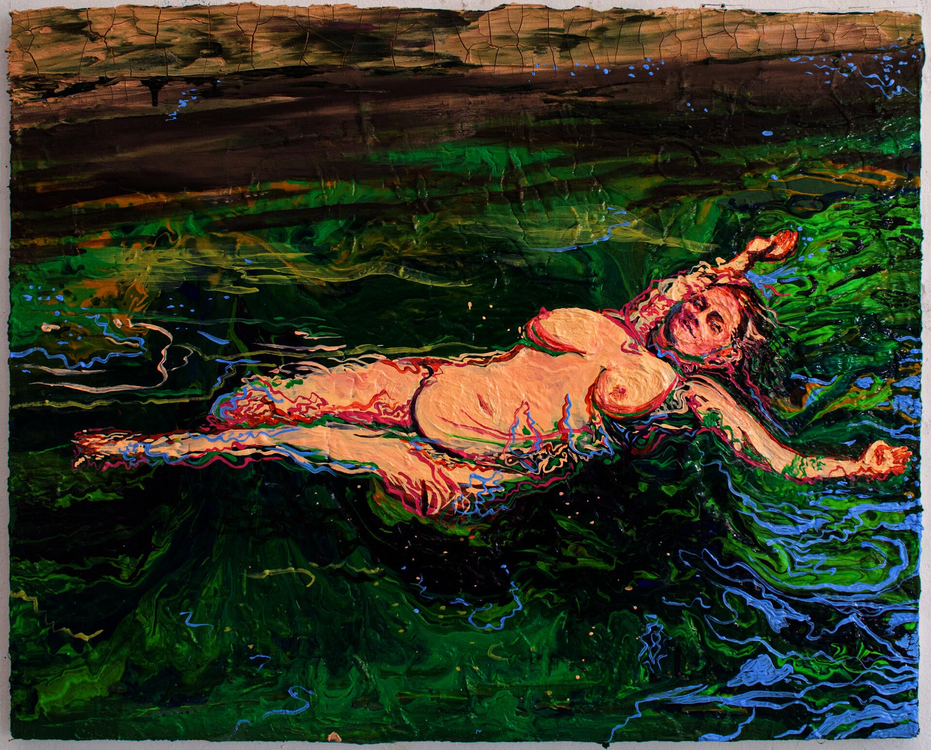 Nude figure floating in fresh green waters