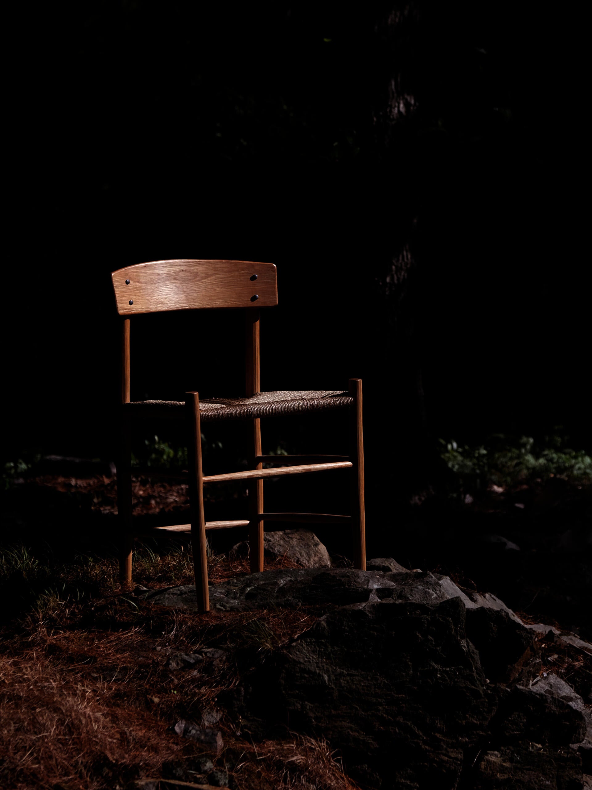An image of Kentucky Danish in the woods. This chair is an interpretation of the J39 chair made from a log using traditional chair making techniques utilized by 1 19th craftspeople in the Appalachian Mountains.8th and
