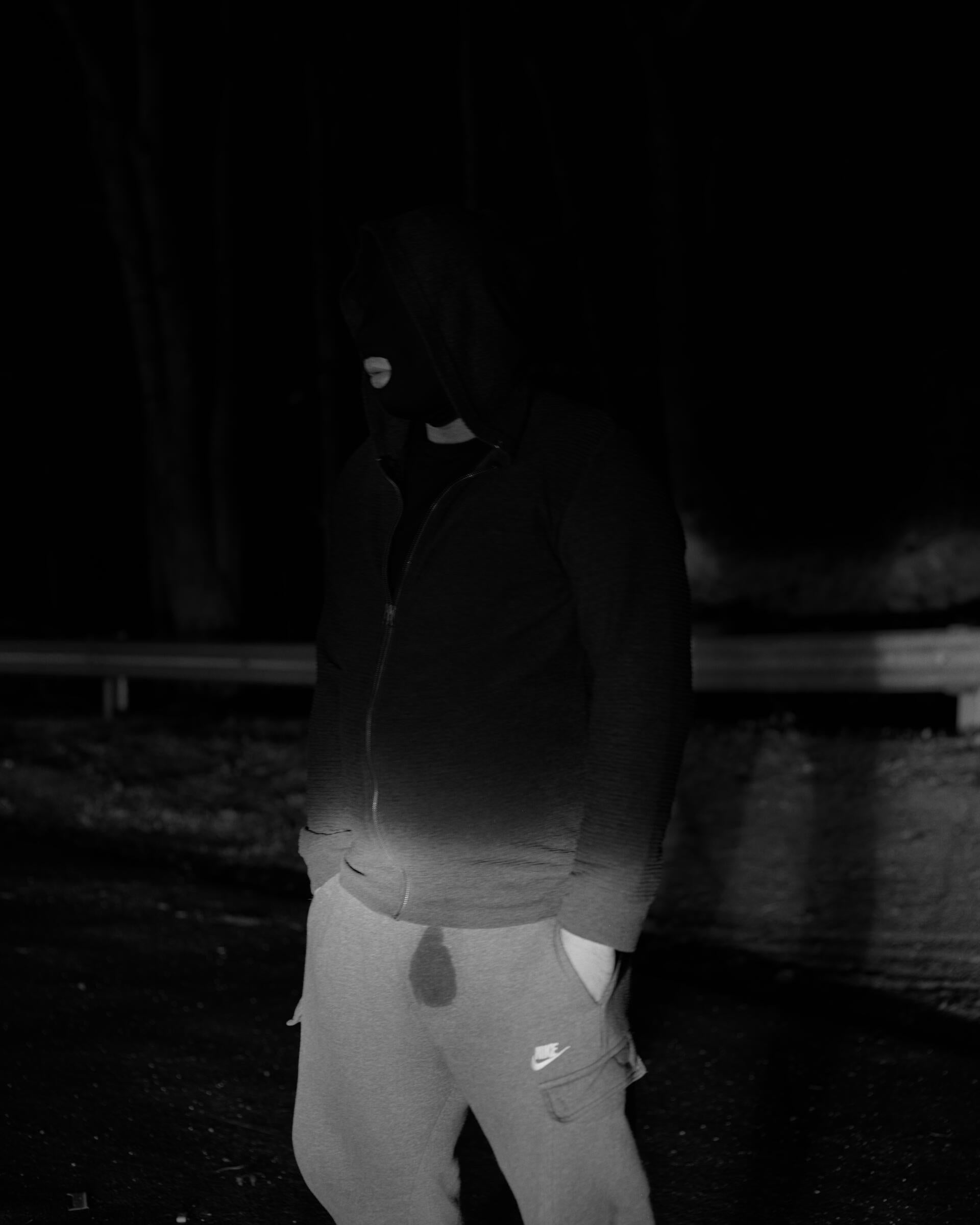 a piss soaked figure in black and white