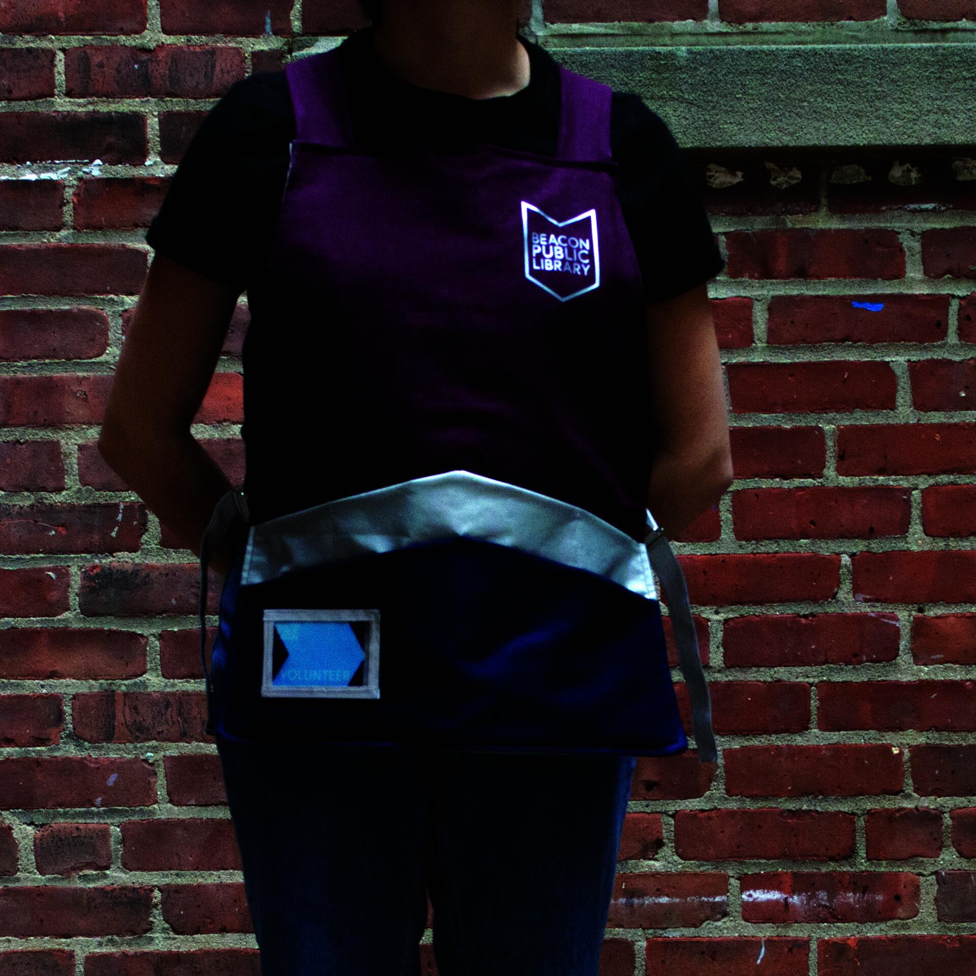 Wearing the library apron