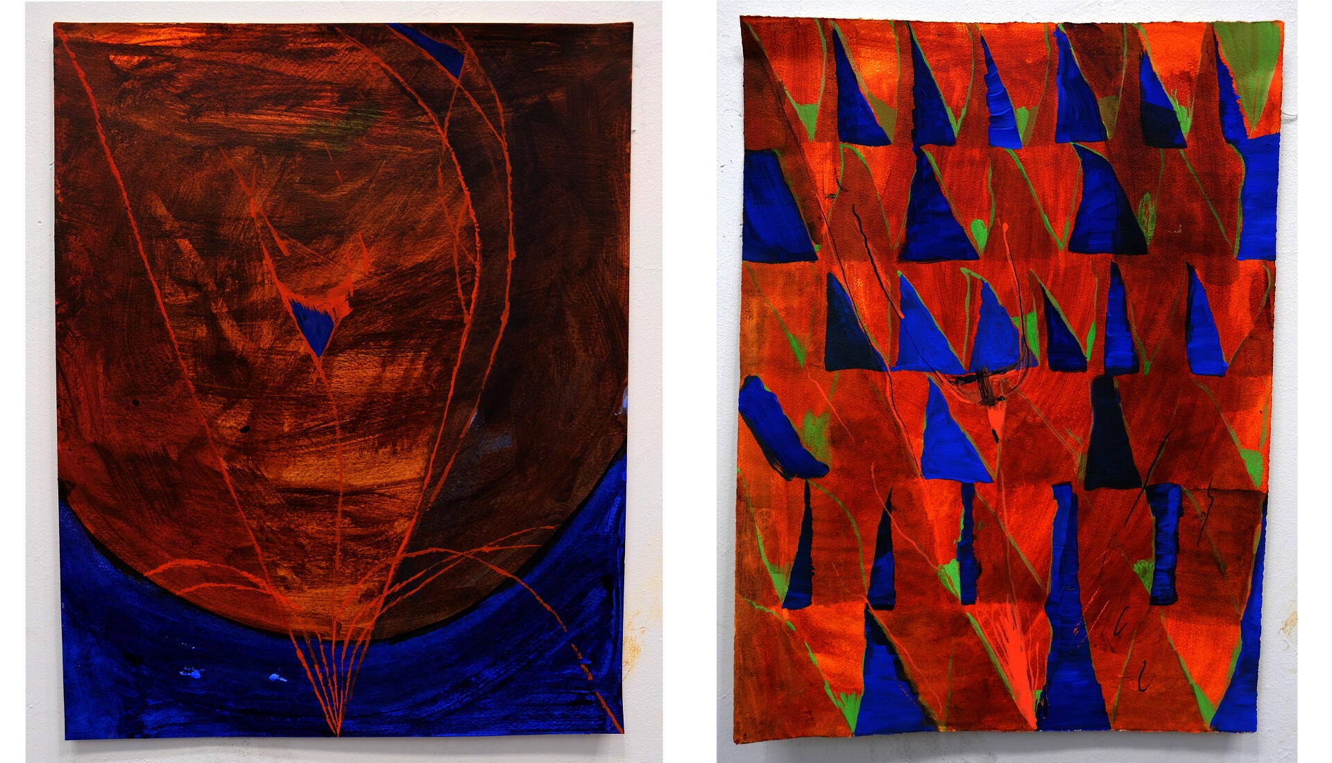 Photo of two drawings in reds and blues of an inverted triangle that becomes the top half of a diver.