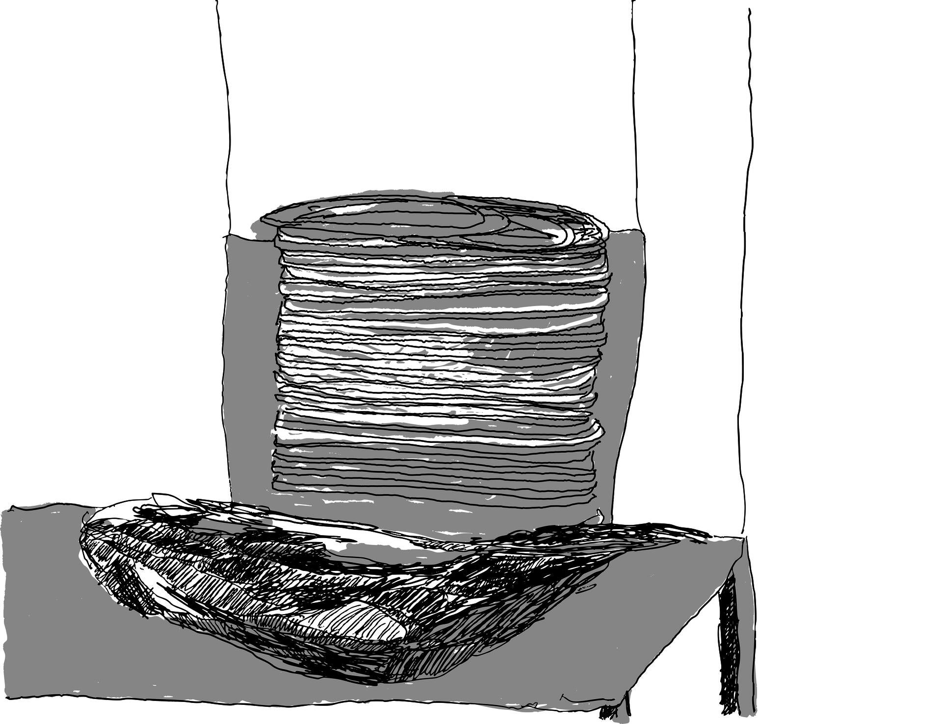 drawing of a scribbly spring on top of a pile of black lines on top of a grey table