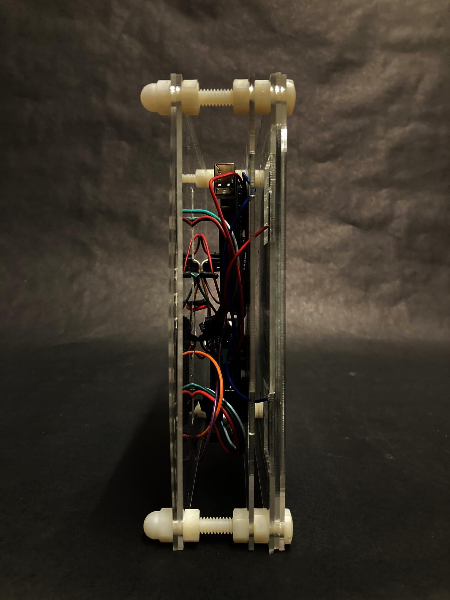 Two panel sandwiching a series of electronic boards that controls and stores the light emitted and absorbed.