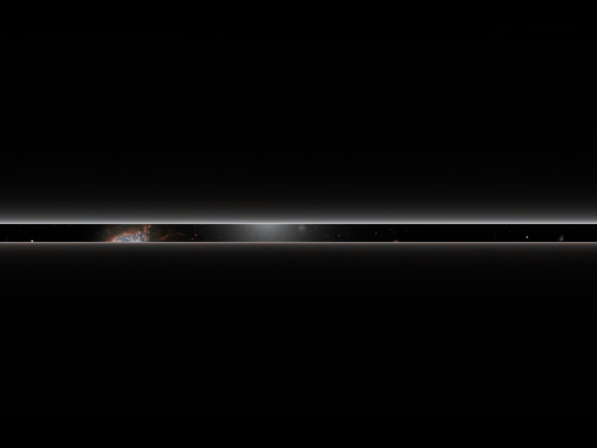 A dense band of stars between two light beams.