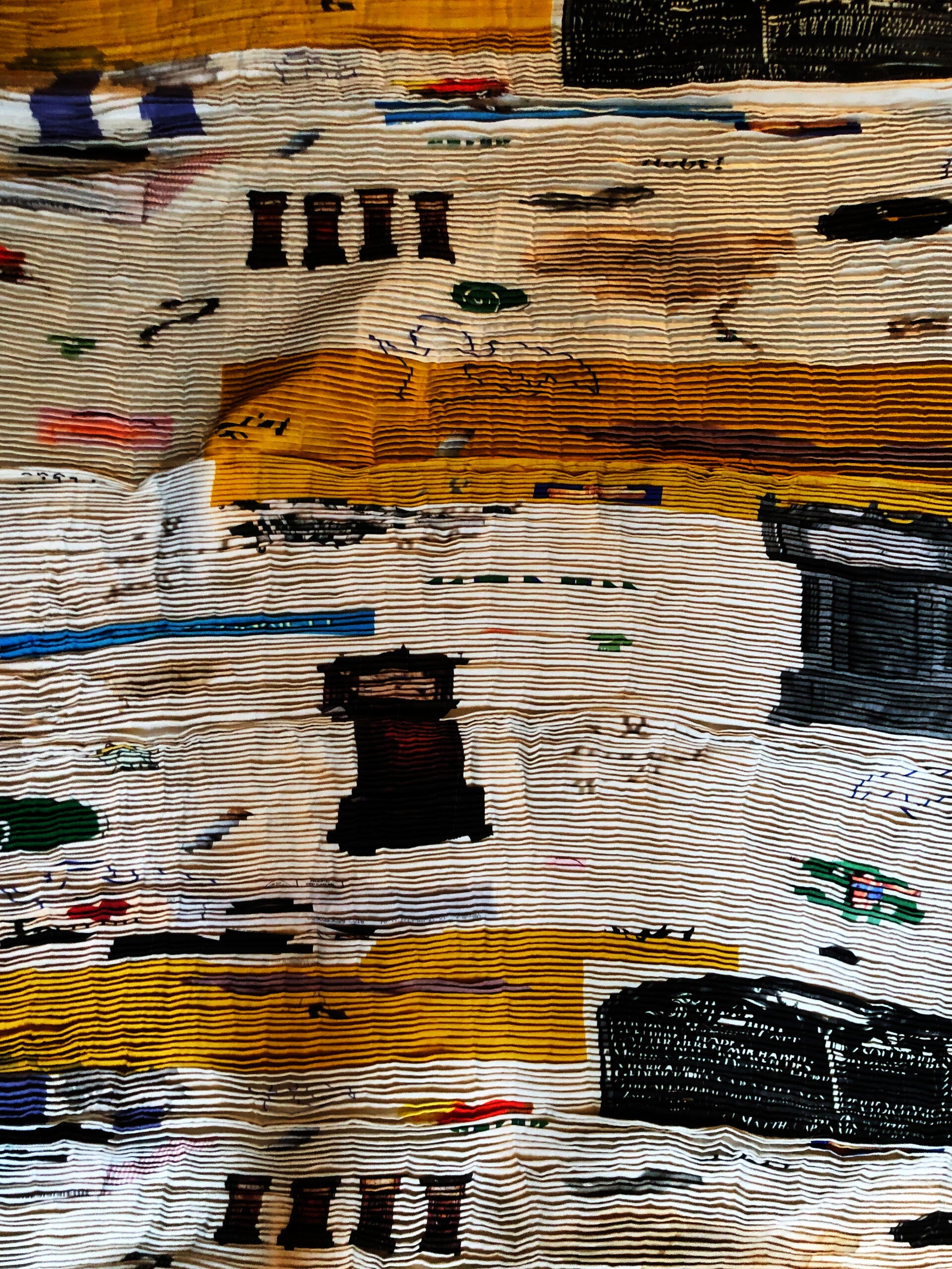 A linen hammock, hand pleated, fragments of weighted memories held in a tapestry.
